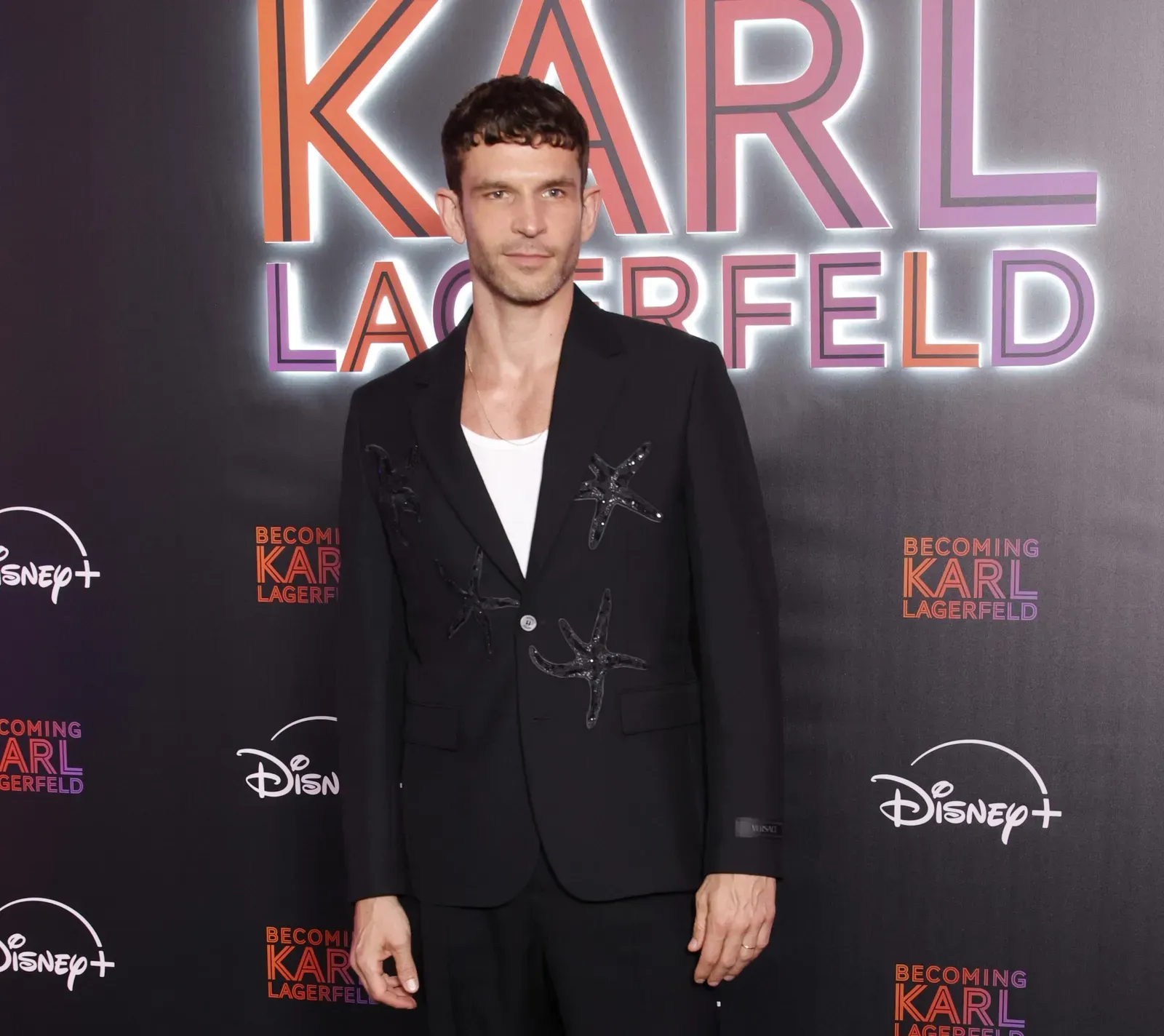 The Versace Starfish Suit: Arnaud Valois’ Stunning Fashion Homage to Yves Saint Laurent at ‘Becoming Karl Lagerfeld’ Premiere