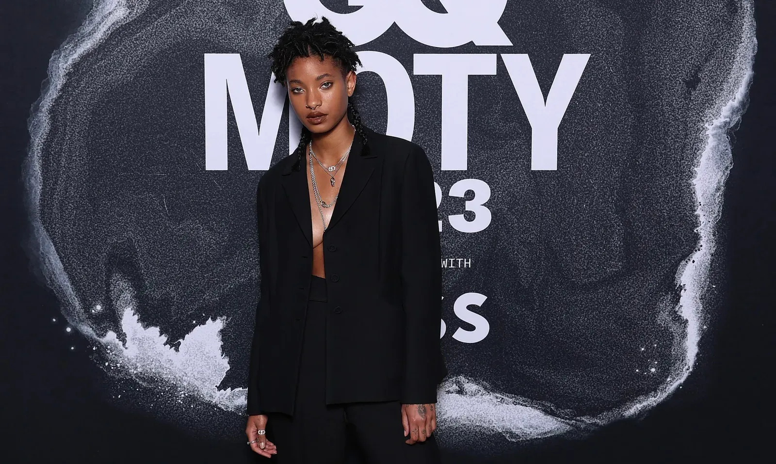 Willow Smith at the GQ Australia Men Of The Year Awards in a tailored black suit, exemplifying androgynous style on the red carpet in Sydney, Australia.