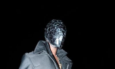 LuvAnthony is pushed down the runway in a glass box for Phenotype by The Radar at New York Fashion Week