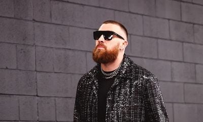 Kansas City Chiefs’ Travis Kelce Captivates in Custom AMIRI Attire at Super Bowl LVIII