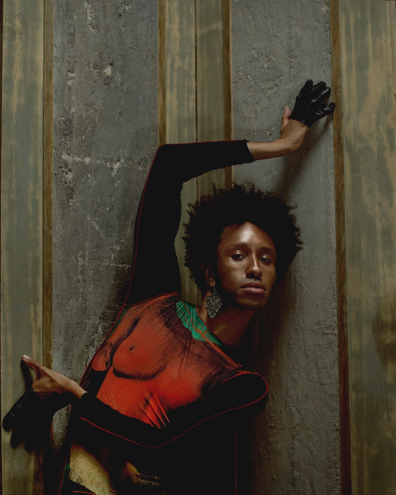 Top by JEAN PAUL GAULTIER, earring, stylist's own, gloves by PAULA ROWAN