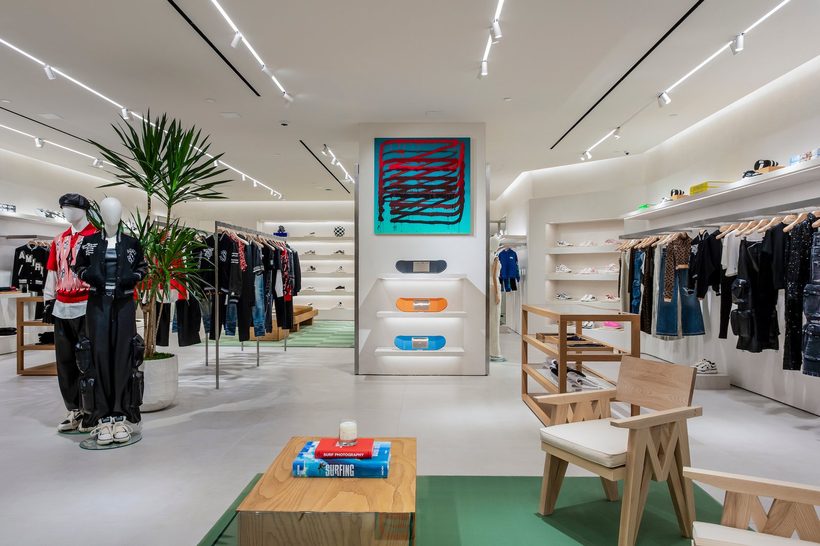 Modern Elegance: A glimpse into the meticulously curated interior of AMIRI Houston, where fashion meets sophisticated design, showcasing a blend of high-end apparel and artful decor.