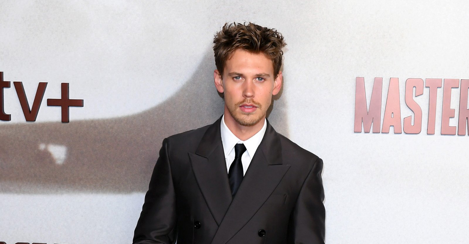 Austin Butler at the London premiere of 'Masters Of The Air', clad in a classic Burberry suit.