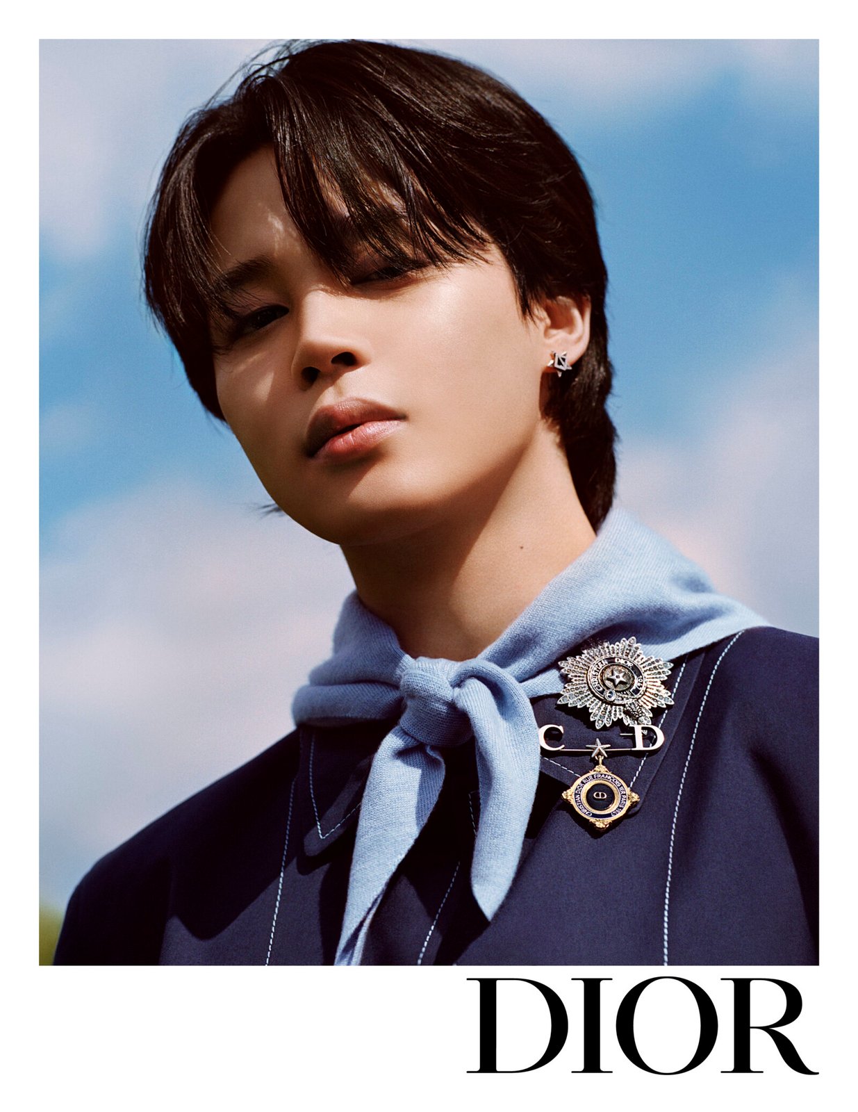 Glistening Under the Sun: A close-up portrait of elegance, capturing Jimin in the intricate details and craftsmanship of Dior