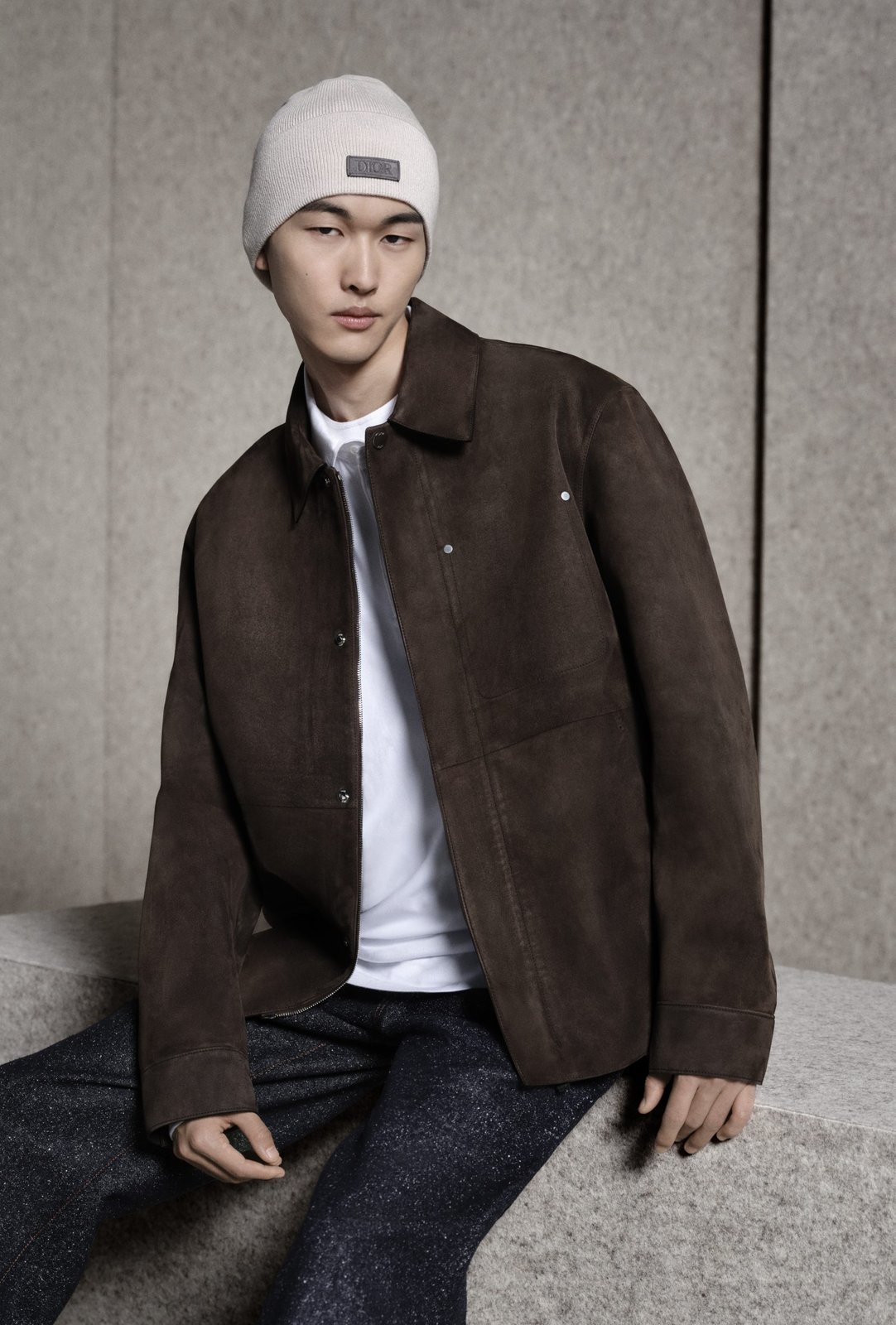 A luxurious suede lambskin Dior Icons jacket, paired with a cotton jersey t-shirt, textured wool trousers, and the signature Dior beanie, defines a refined winter wardrobe. (Imagery: Courtesy of Dior)