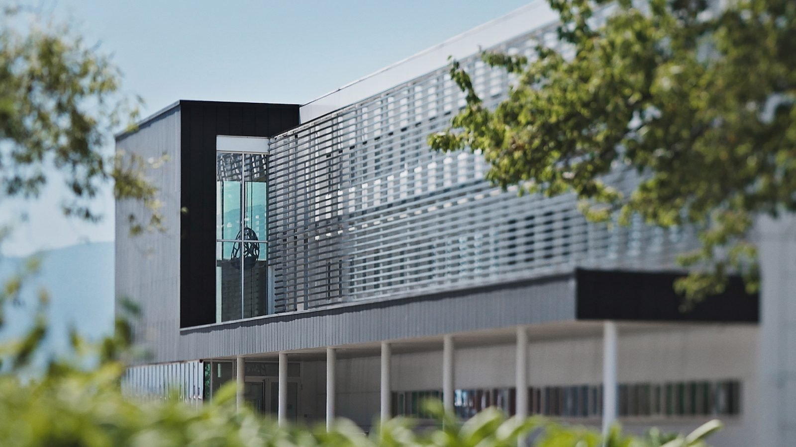 La Fabrique du Temps Louis Vuitton in Meyrin, Switzerland—a 4,000-square-meter hub of horological innovation, where master watchmakers shape the future of timekeeping beneath the towering Alps. (Image: Courtesy of Louis Vuitton)