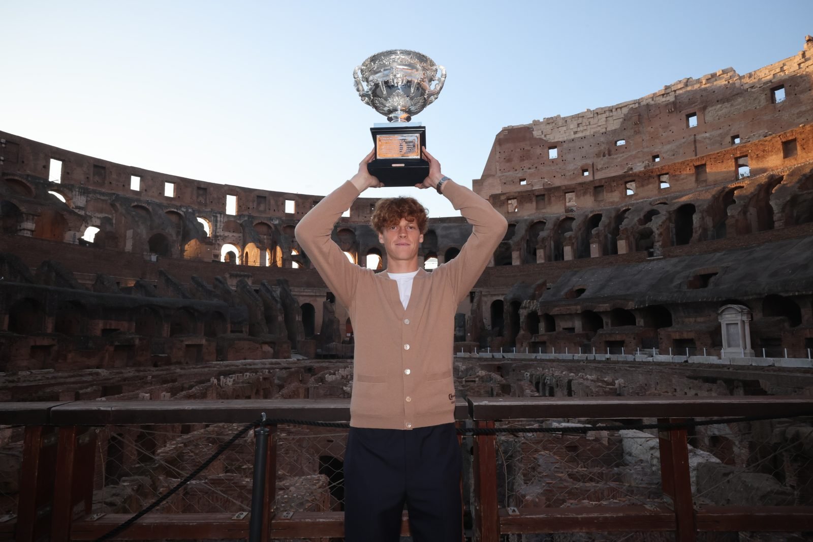 Jannik Sinner wears Gucci to accept his trophy for the Nitto ATP Finals 2023 at the Colosseum.