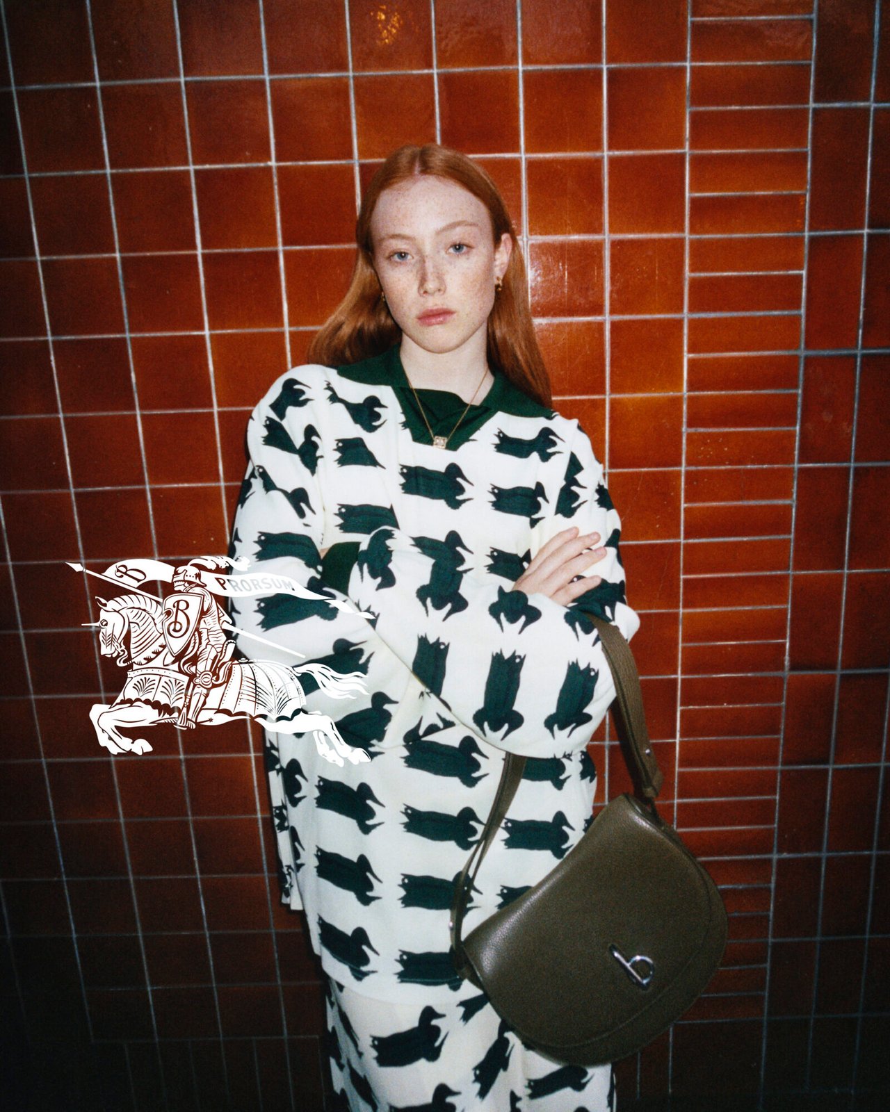 Embracing Burberry's whimsical side, the Spring 2024 collection features a playful duck print, paired with the elegance of a classic leather bag, showcasing the brand's unique blend of tradition and spirited design under Daniel Lee.