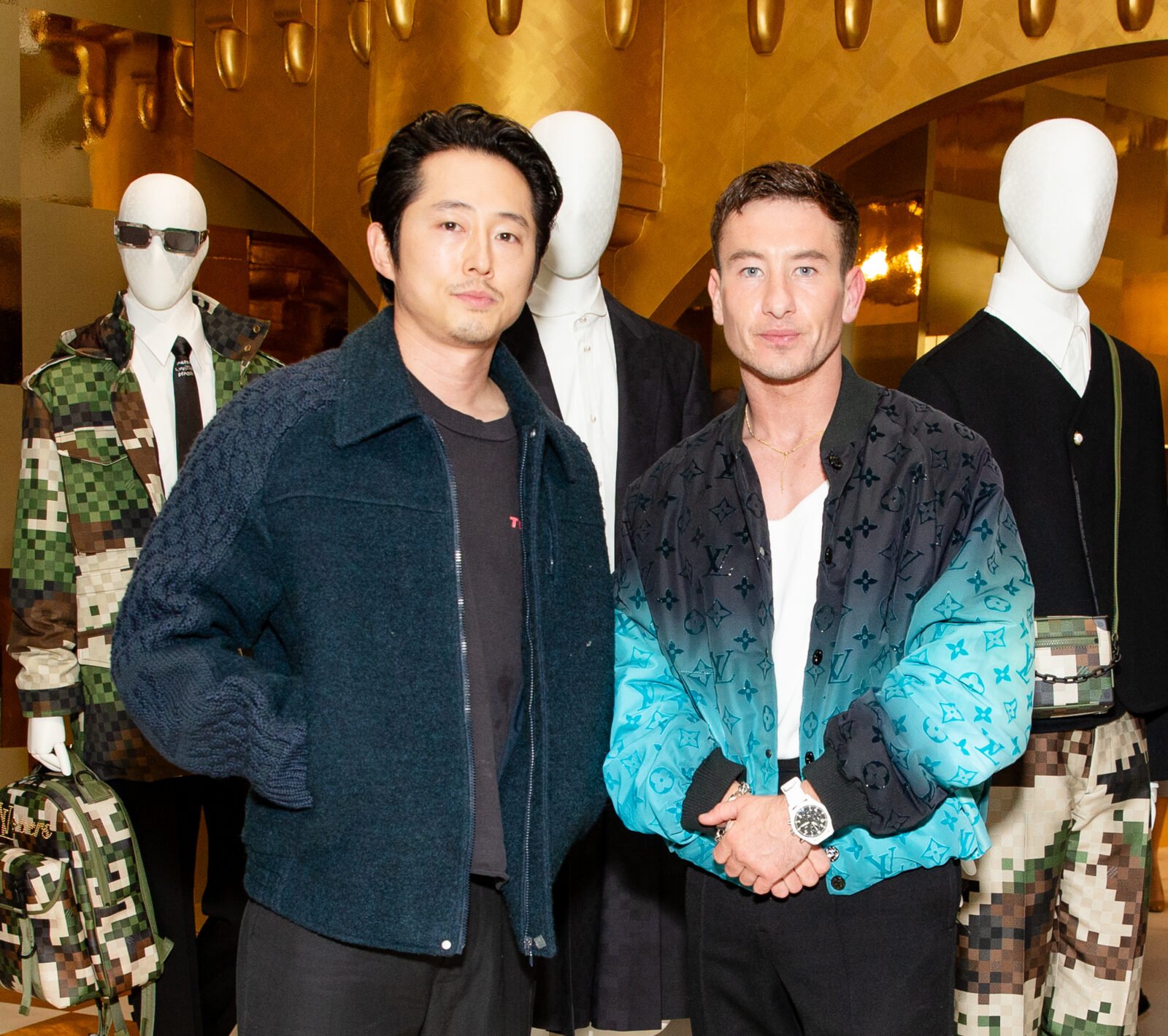 Actors Steven Yeun and Barry Keoghan exude effortless style at the Louis Vuitton event, standing amidst the architectural splendor inspired by Pharrell’s debut collection.