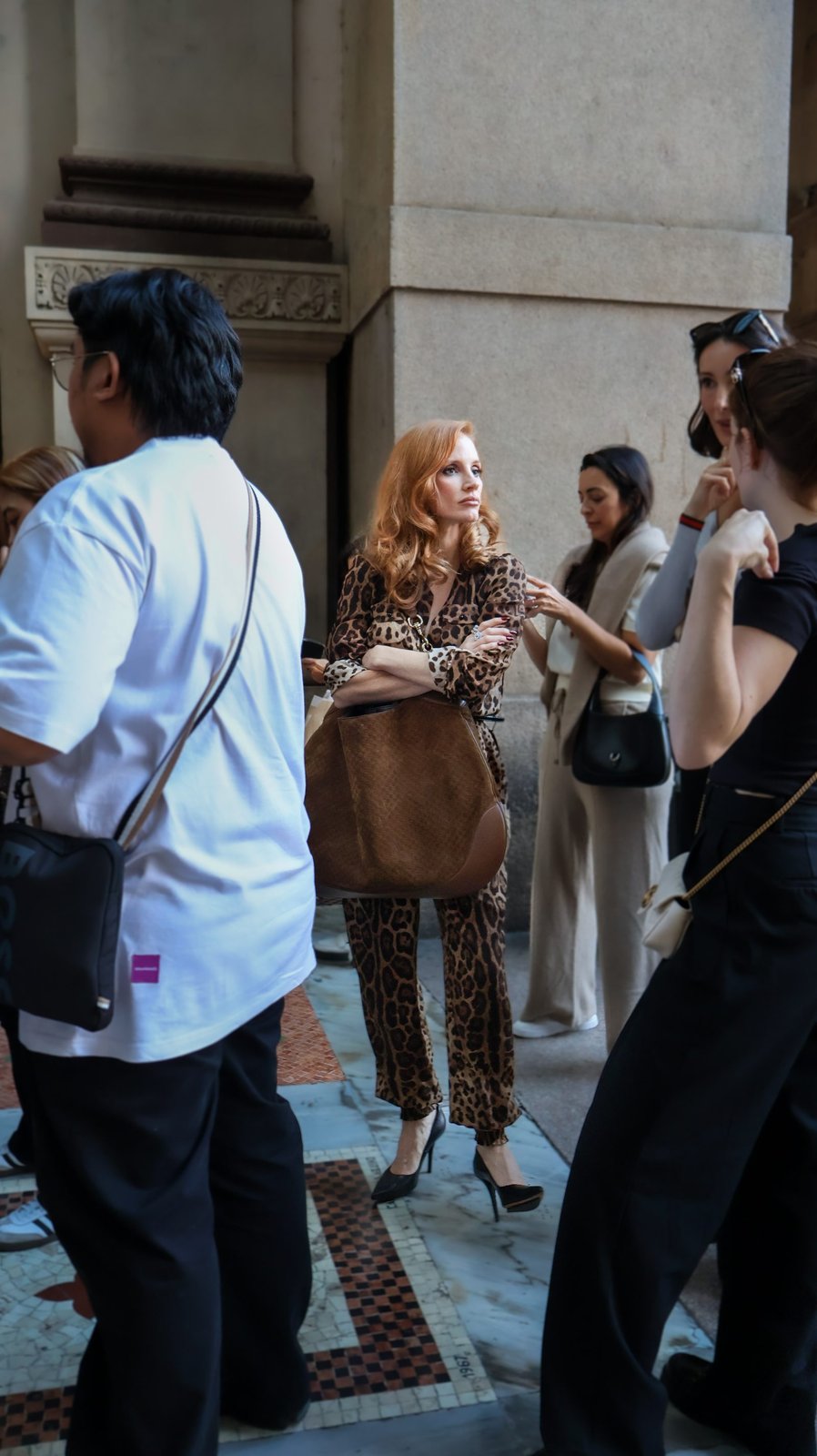 Jessica Chastain exudes timeless elegance at the Galleria Vittorio Emanuele II, the Gucci B shoulder bag adding a touch of modern luxury to her ensemble (Image courtesy of Gucci/Jessica Chastain).