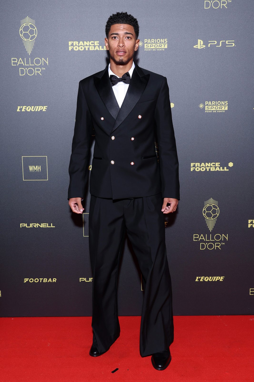 Jude Bellingham, epitomizing elegance in a custom Louis Vuitton double-breasted suit, graces the 2023 Ballon d’Or® ceremony. (Photo by Pascal Le Segretain/Getty Images)