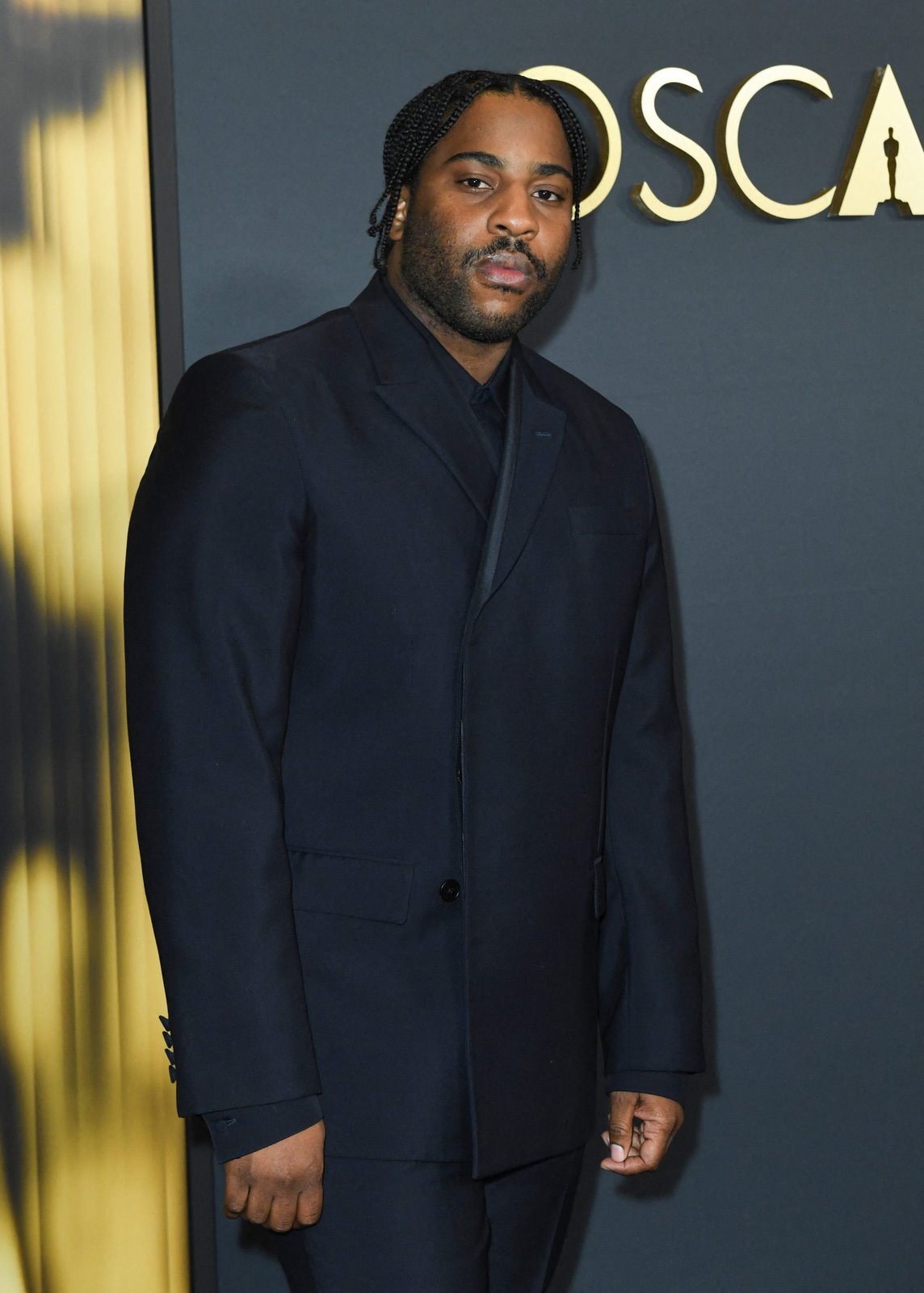 Malcolm Washington arrives at the Governors Awards wearing Gucci (Photo by VALERIE MACON / AFP) (Photo by VALERIE MACON/AFP via Getty Images)