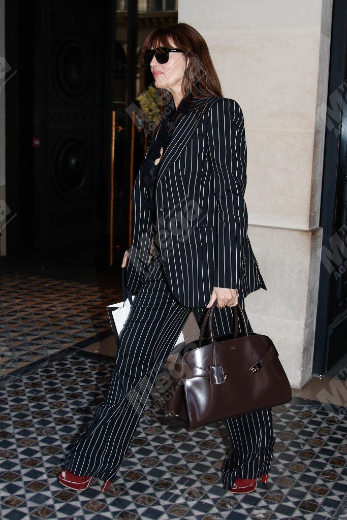 Monica Belluci is seen carrying the Ferragamo Hug bag illuminating its versatility as a handbag for daytime or evening