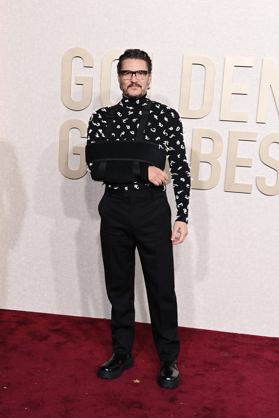 Pedro Pascal defines modern sophistication with Bottega Veneta's contemporary menswear on the Golden Globes red carpet. (Photo by Jon Kopaloff/WireImage,)