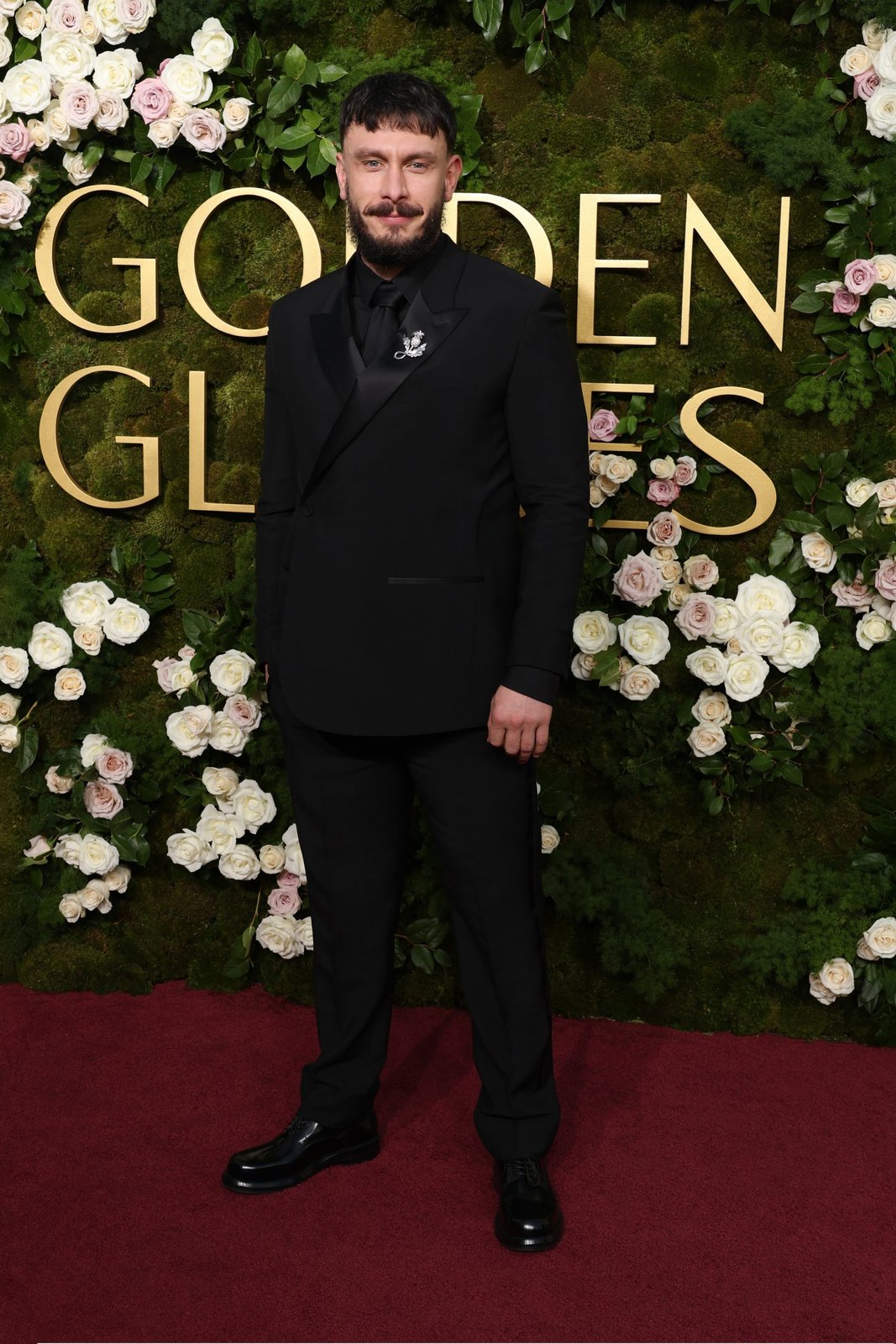 Richard Gadd wore a black wool and silk oblique tuxedo, a black cotton shirt, and a black silk tie. He also wore a silver brooch and black leather derbies. (Photo: Getty Images)