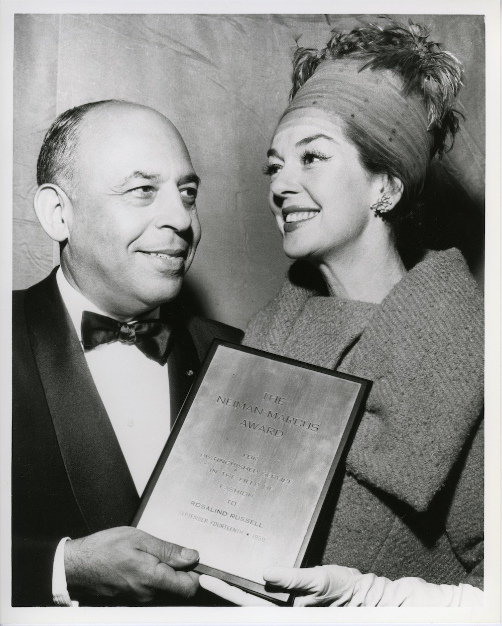 Rosalind Russell receiving the Neiman Marcus Fashion Award from Stanley Marcus