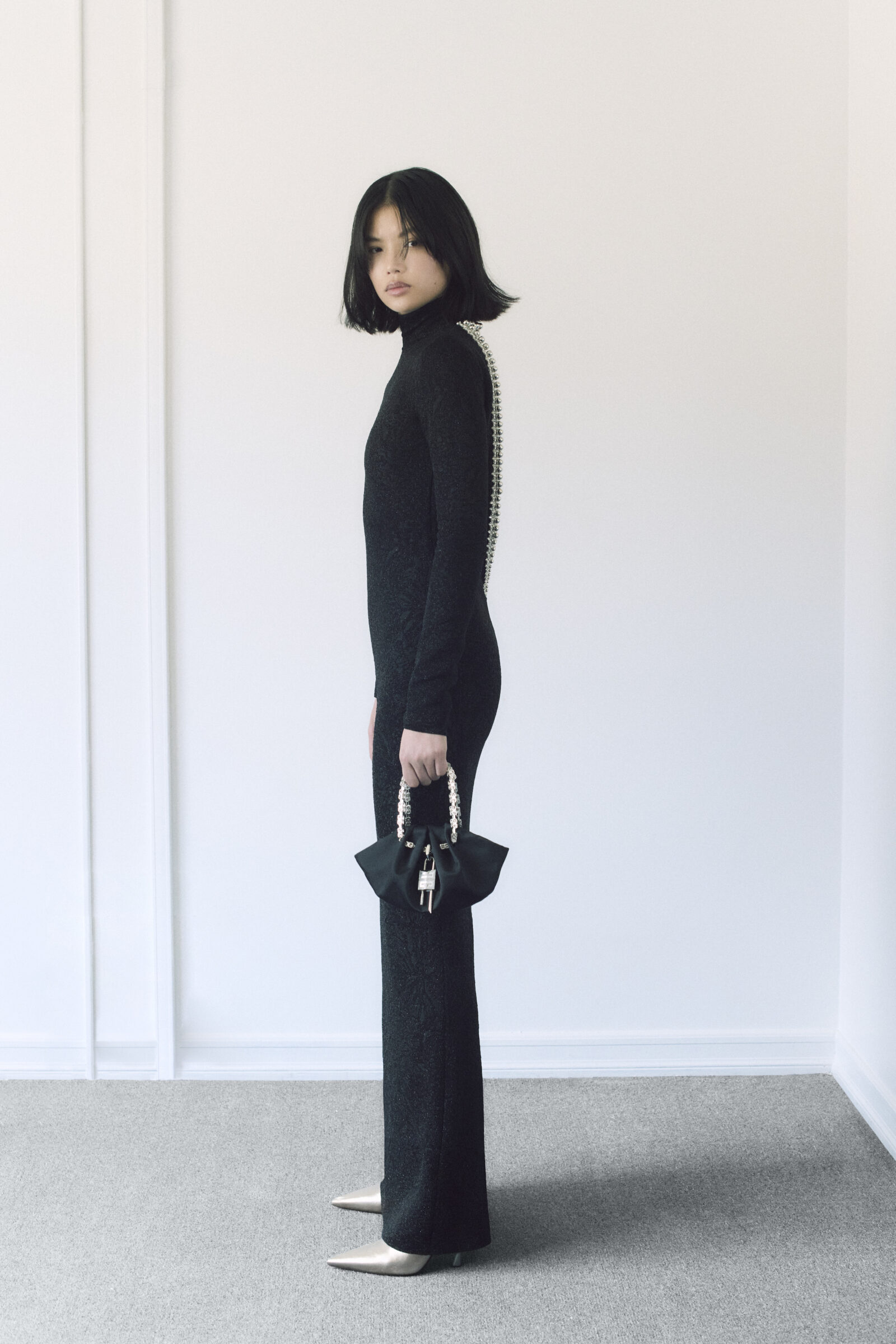 A redefinition of elegance: This Givenchy look blends timeless monochromes with daring design, showcasing the plunging backline that marks the collection's bold innovation.