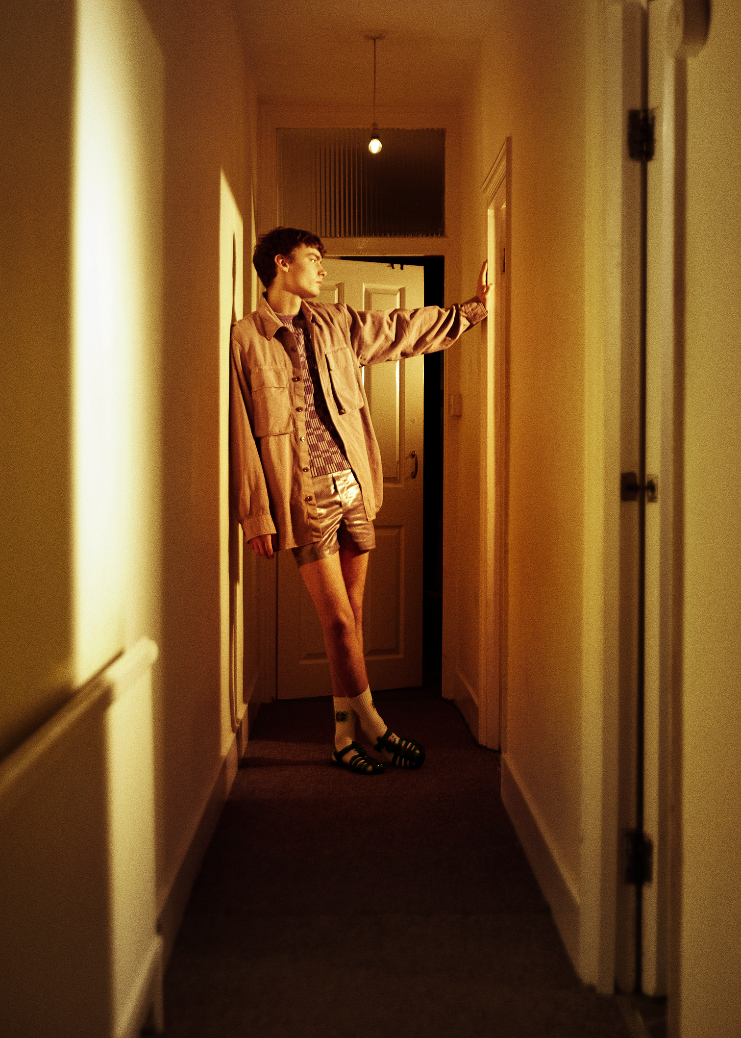 Shirt by DRIES VAN NOTEN, top by JACQUEMUS, shorts by SEAN SUEN, shoes by GUCCI