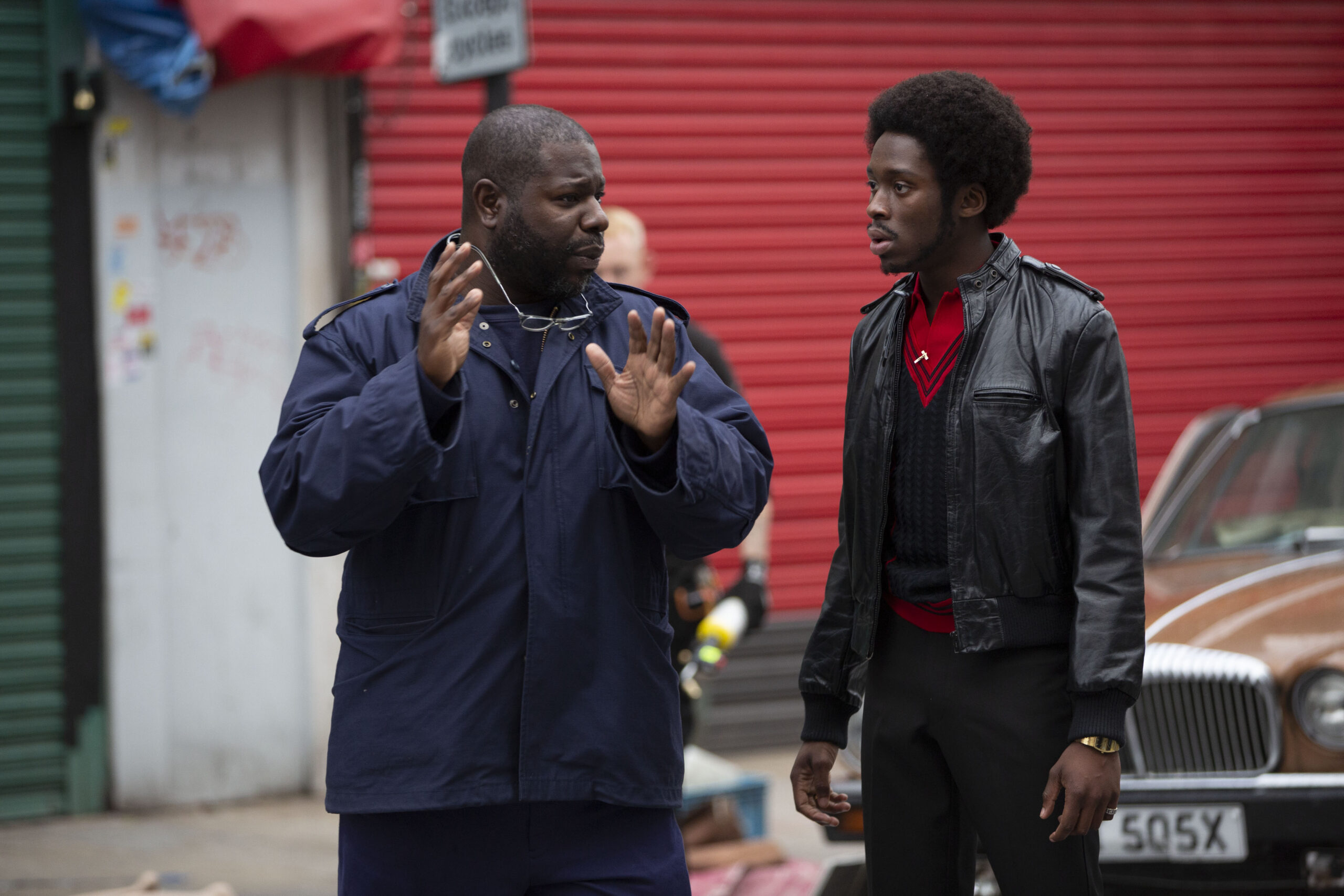 Steve McQueen on set with Sheyi Cole. Alex Wheatle Small Axe, a series by Steve McQueen Credit: Will Robson-Scott © Small Axe Films Limited / Turbine Studios Limited / Lammas Park Limited Steve McQueen on set with Sheyi Cole.
Alex Wheatle
Small Axe, a series by Steve McQueen
Credit: Will Robson-Scott © Small Axe Films Limited / Turbine Studios Limited / Lammas Park Limited