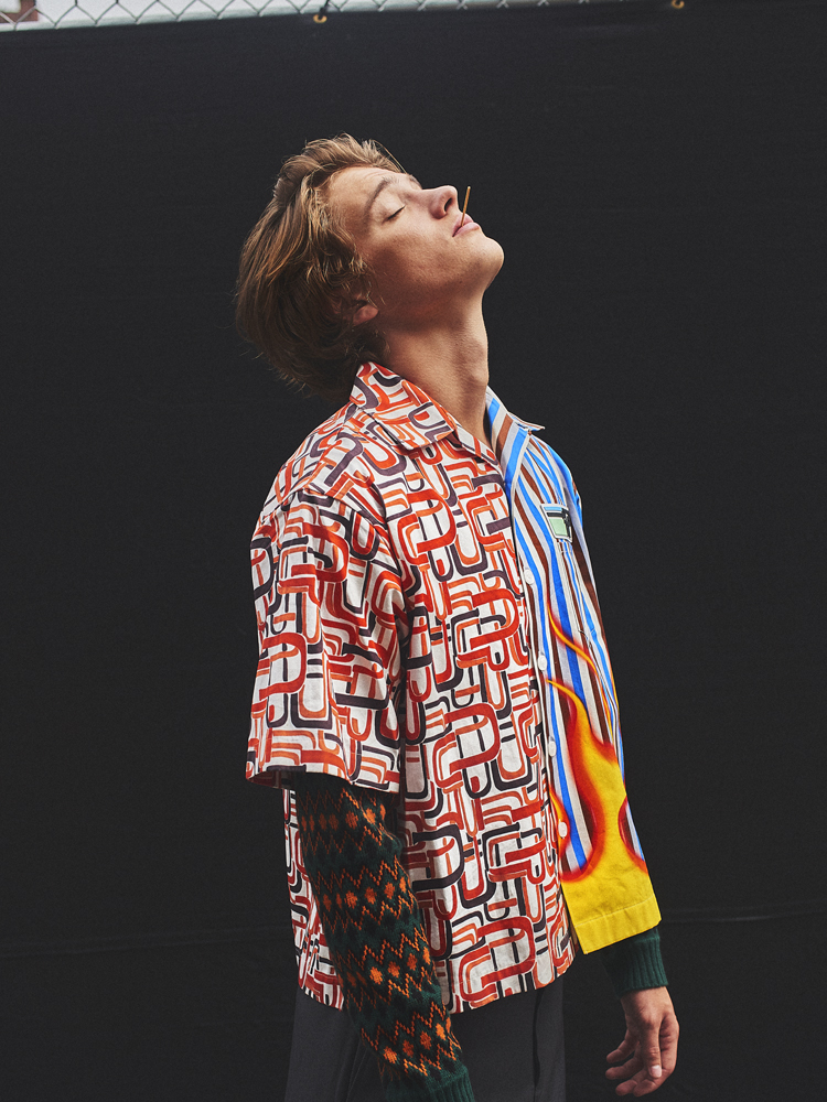 Shirt, sweater, and short by PRADA