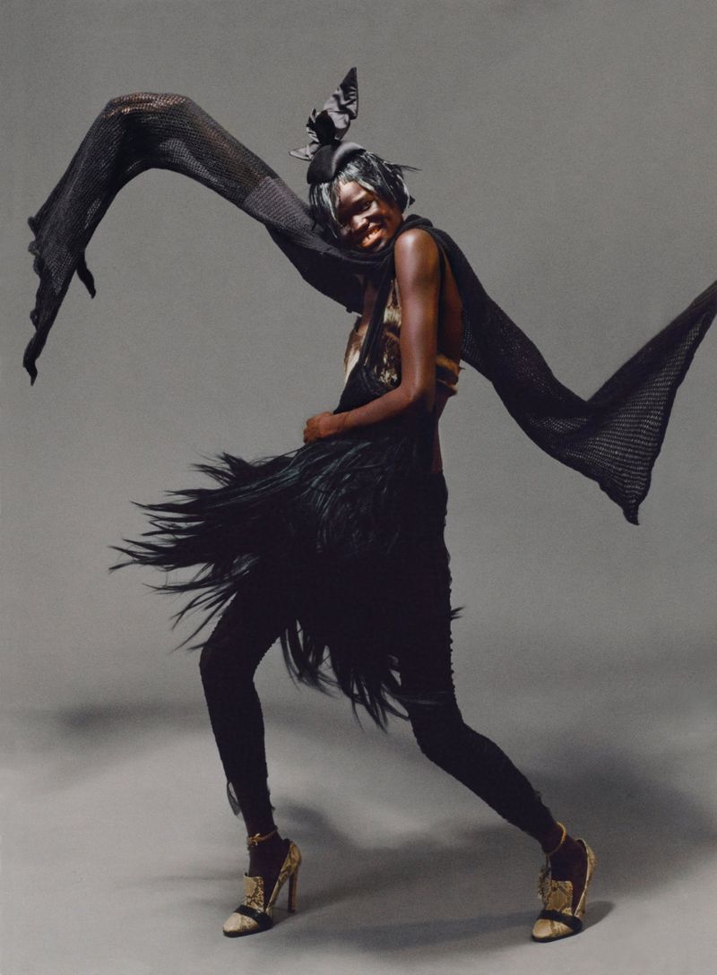 top by ISSEY MIYAKE, headpiece from the NATIONAL THEATRE, bra from COSTUME STUDIO, bag by STEVEN TAI, shoes stylist’s own
