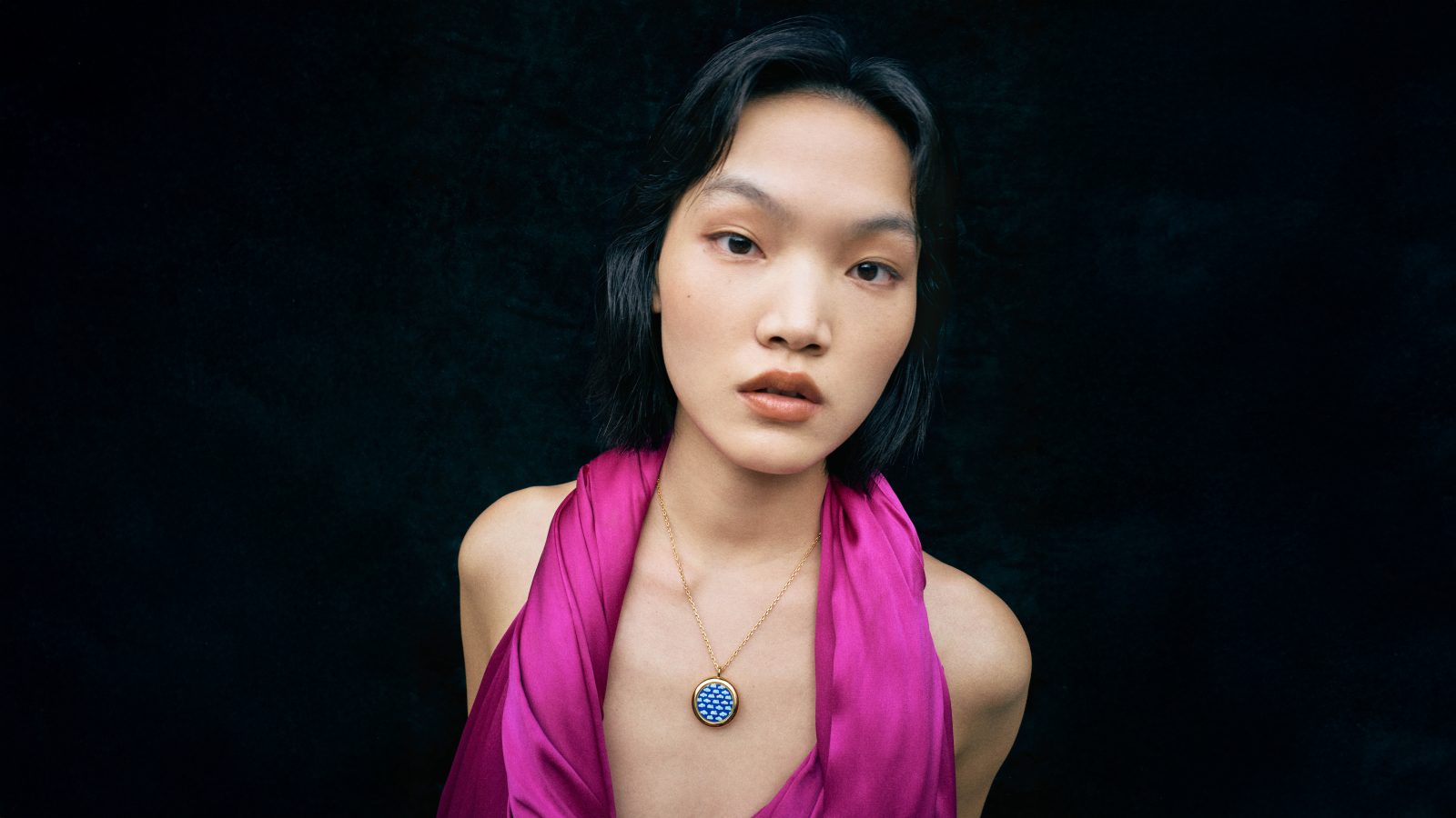 A cloisonné pendant with cloud motifs in cobalt enamel, showcasing the collection's signature technique (Photo: Courtesy of LOEWE)