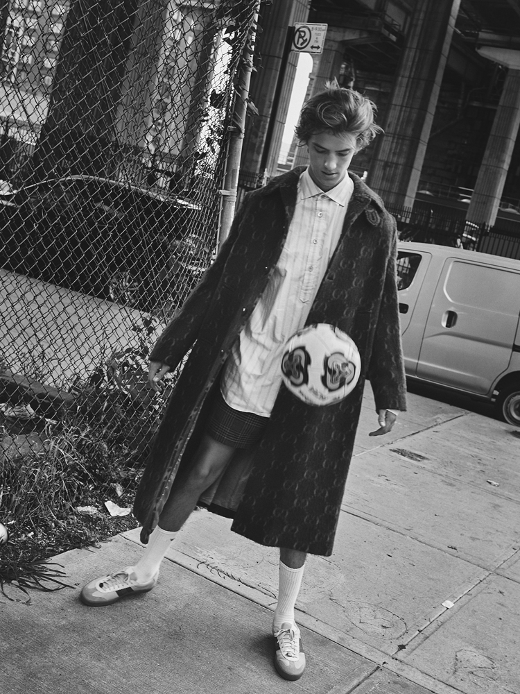 Coat, shirt, shorts, socks, and sneakers by GUCCI