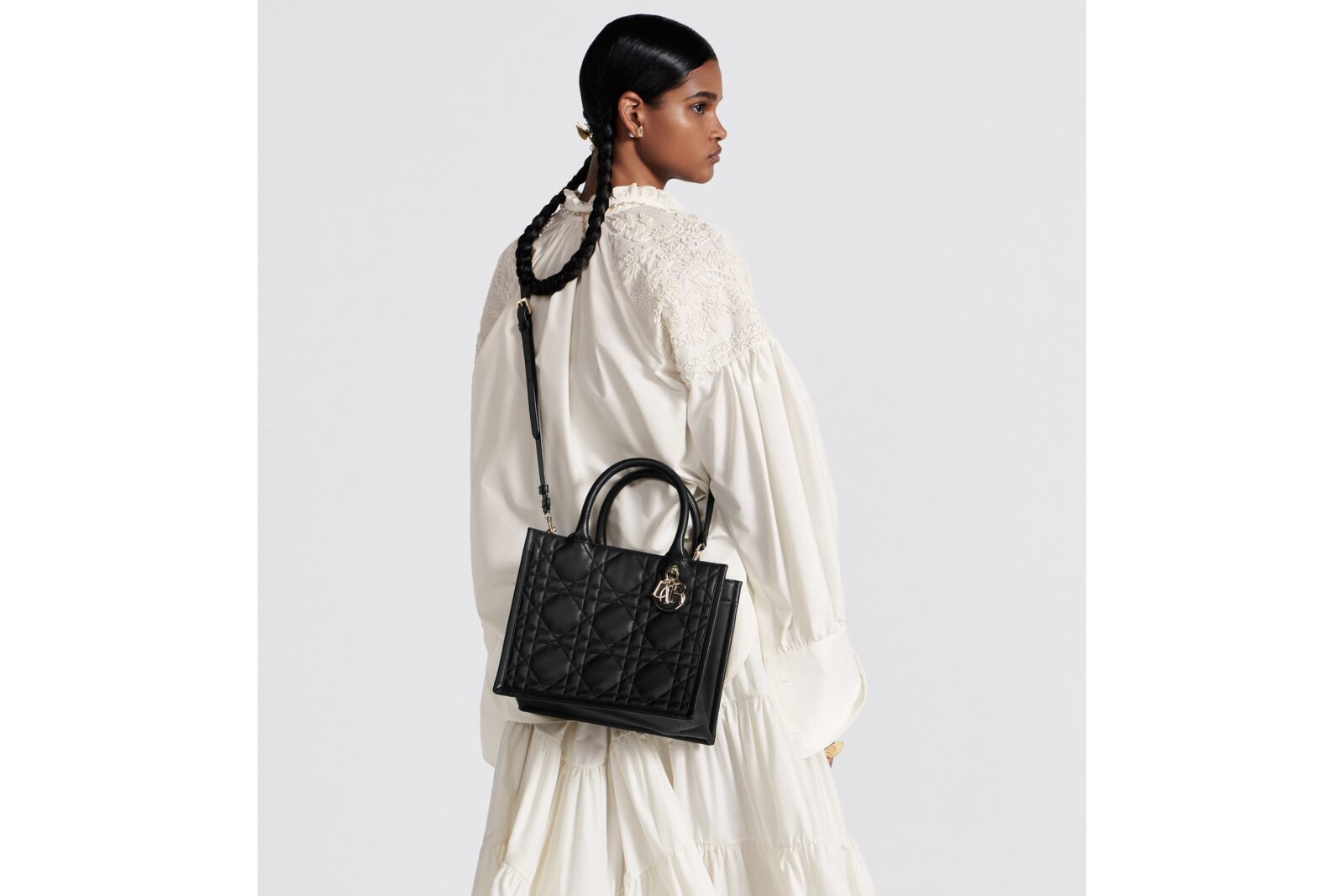 Elegance in Hand: The medium Dior Book Tote, a perfect blend of Dior's craftsmanship and everyday versatility.