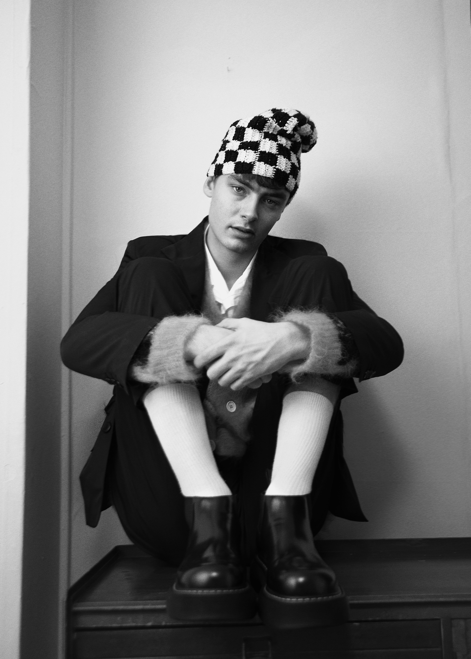 Jacket and trousers by MOLLY GODDARD, shirt by STILL BY HAND, cardigan by MARNI, shoes by BOTTEGA VENETA, hat by SUSSY