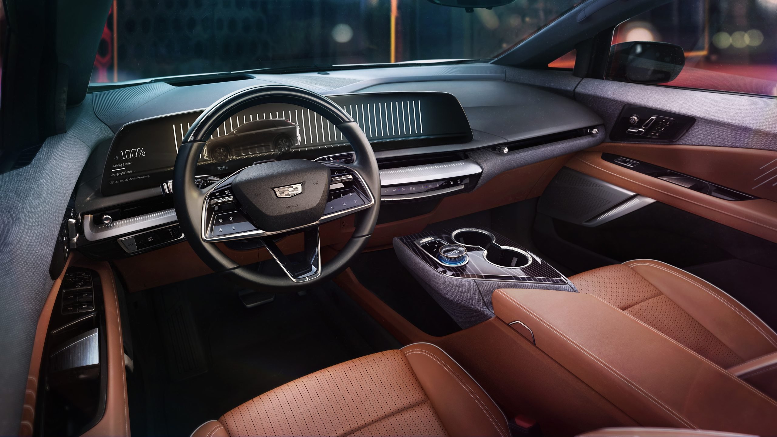 The 2025 Cadillac OPTIQ interior merges luxury craftsmanship with cutting-edge technology, featuring Autumn Canyon leather and a sweeping 33-inch-diagonal 9K interface. (Photo: Courtesy of Cadillac)