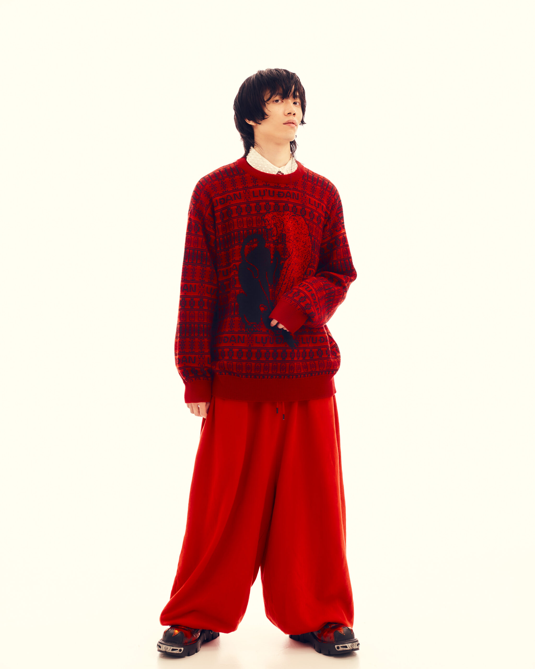 Sweater by LỰU ĐẠN, shirt by ANDREA POMPILIO, bottom by LỰU ĐẠN, shoes by NEWROCK.