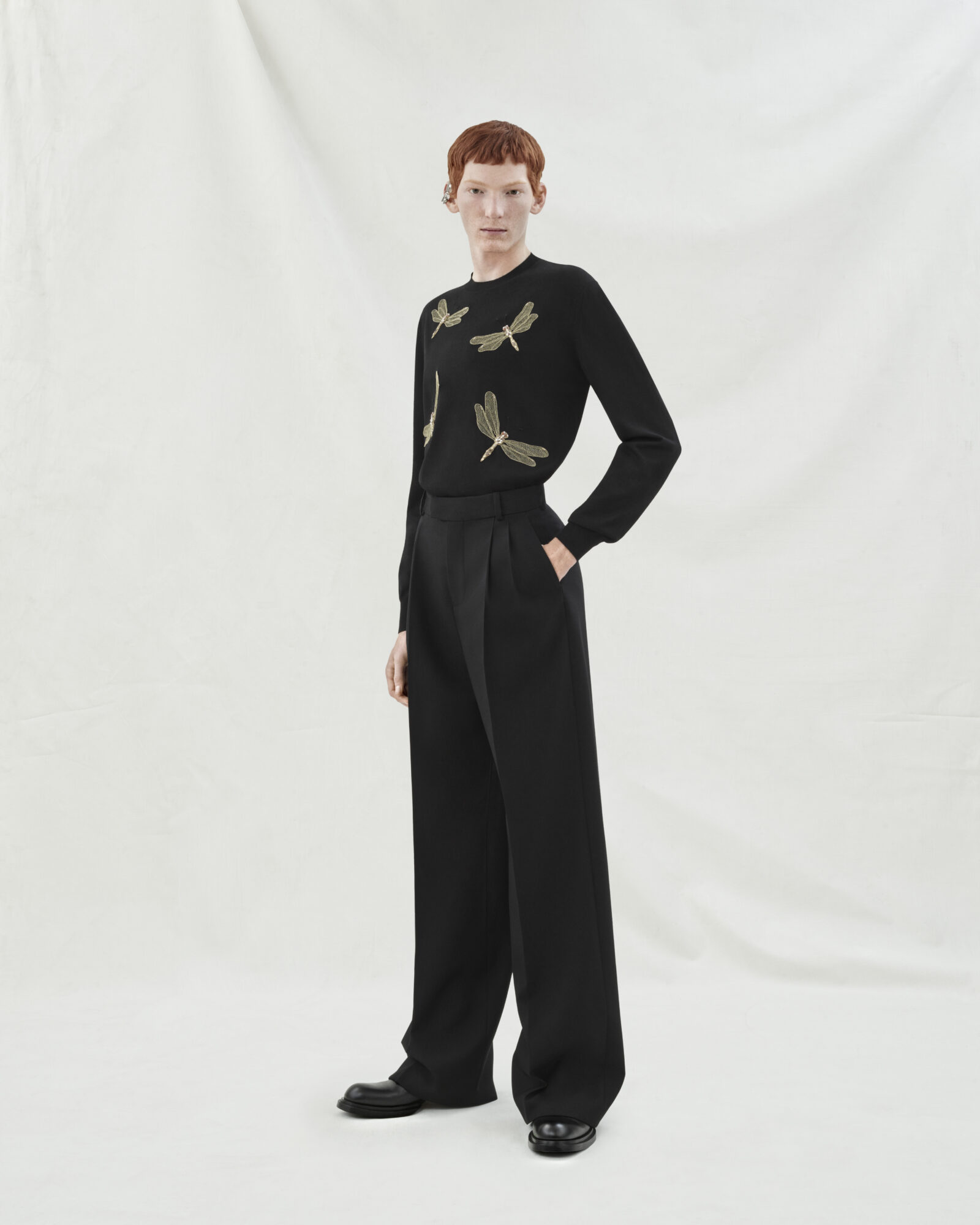 Look 24: Black merino wool jumper highlighted with jewelled dragonfly embroidery Look 24: Black merino wool jumper highlighted with jewelled dragonfly embroidery