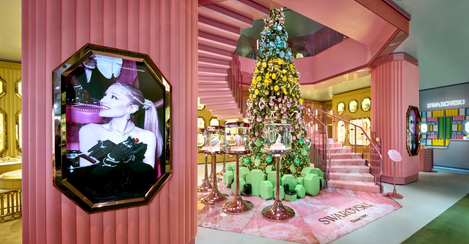 Inside, a whimsical pink environment featuring a crystal-adorned Christmas tree welcomes guests into a retro-glam and art deco-inspired space. (Photo: Courtesy of Swarovski)