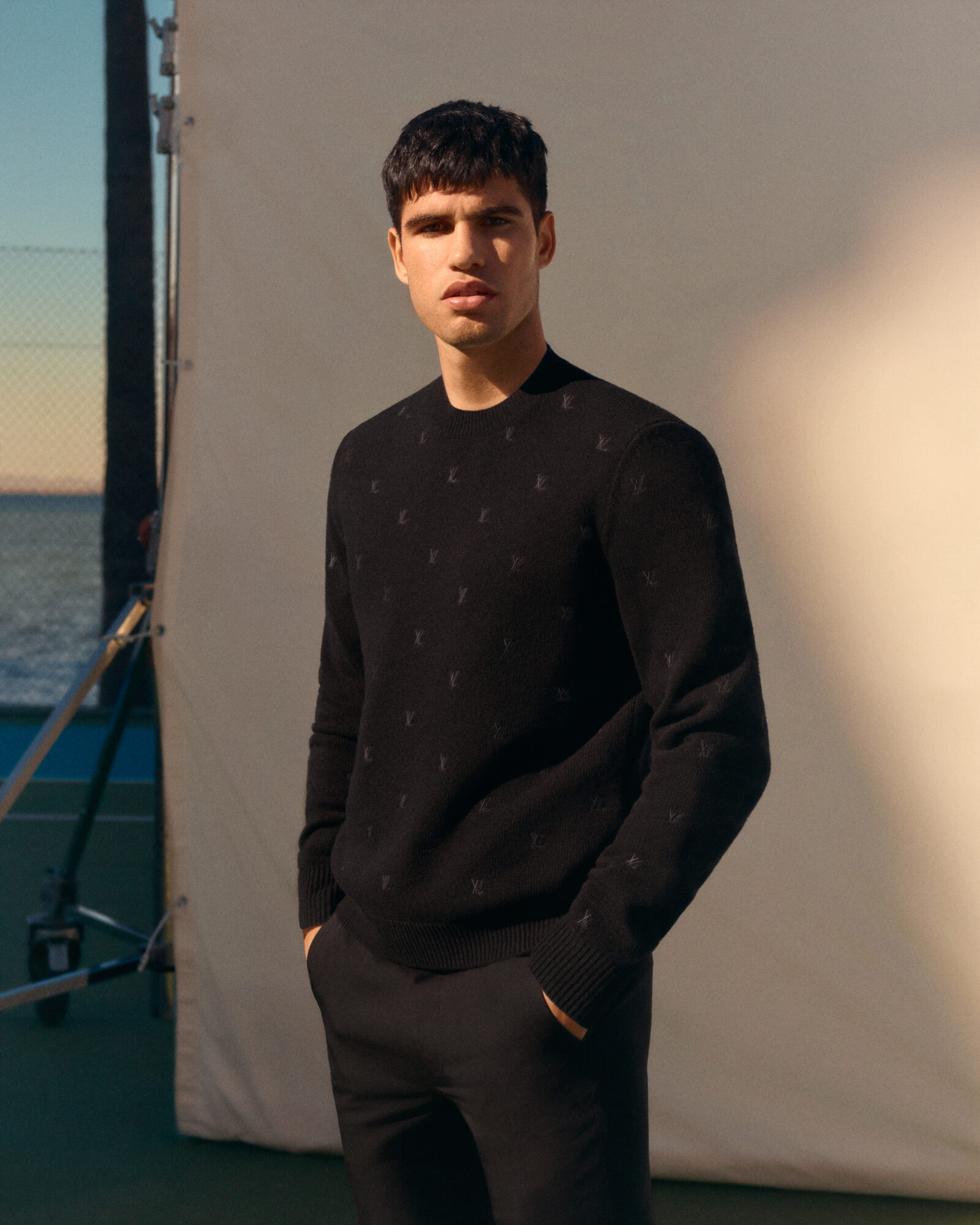 A Serve of Style: Alcaraz stands tall, his Louis Vuitton trunk bearing witness to a legacy in the making.