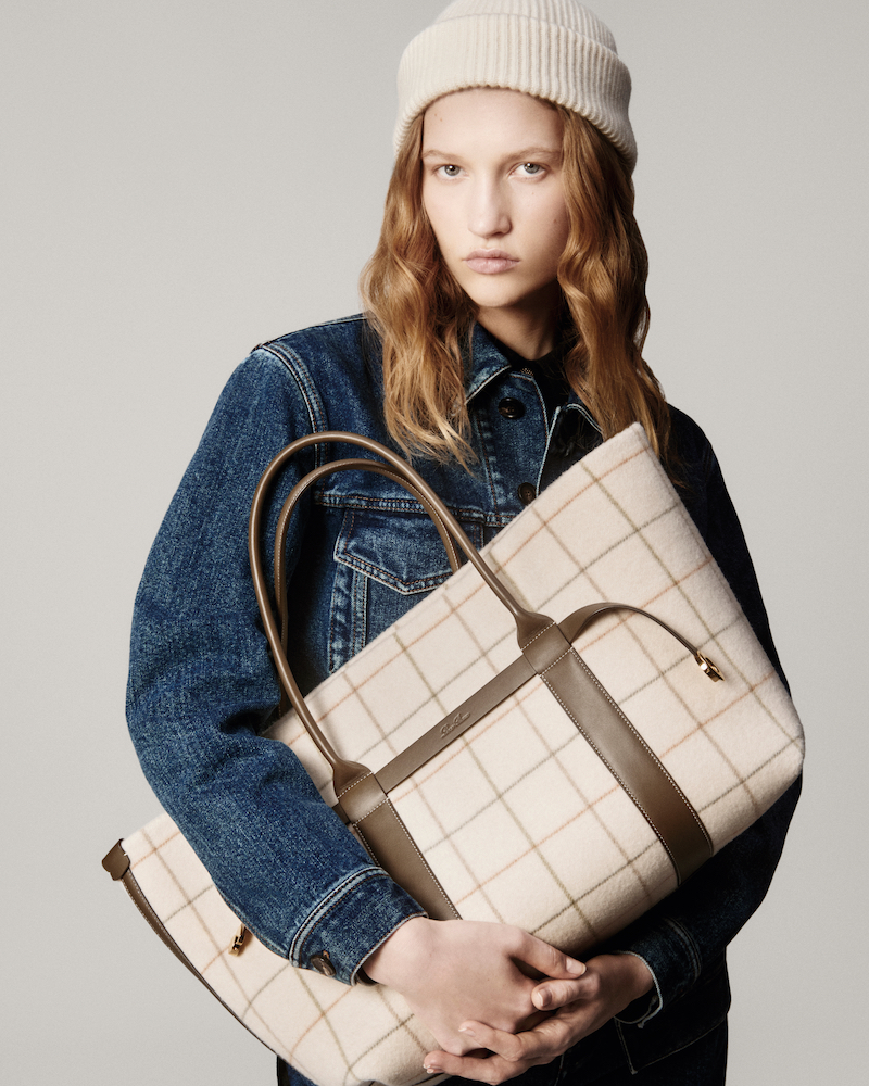 The Ghiera Shopper Belt version in windowpane cashmere showcased with casual denim, highlighting its versatile styling potential. Loro Piana Ghiera Shopper