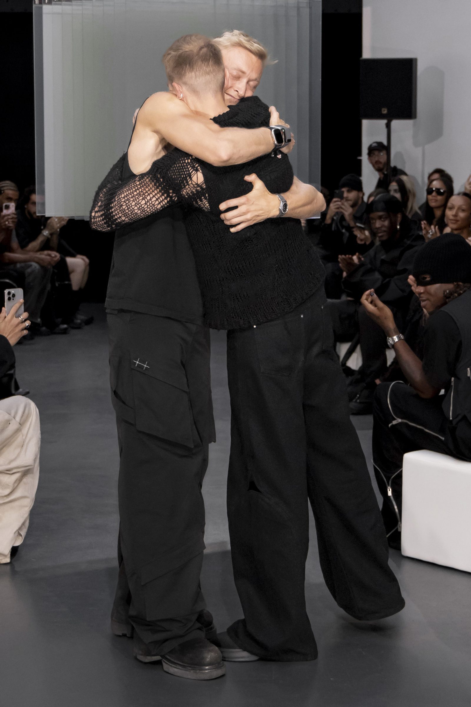 The Juul brothers embrace at the close of the Heliot Emil Spring-Summer 2025 runway show in Paris.