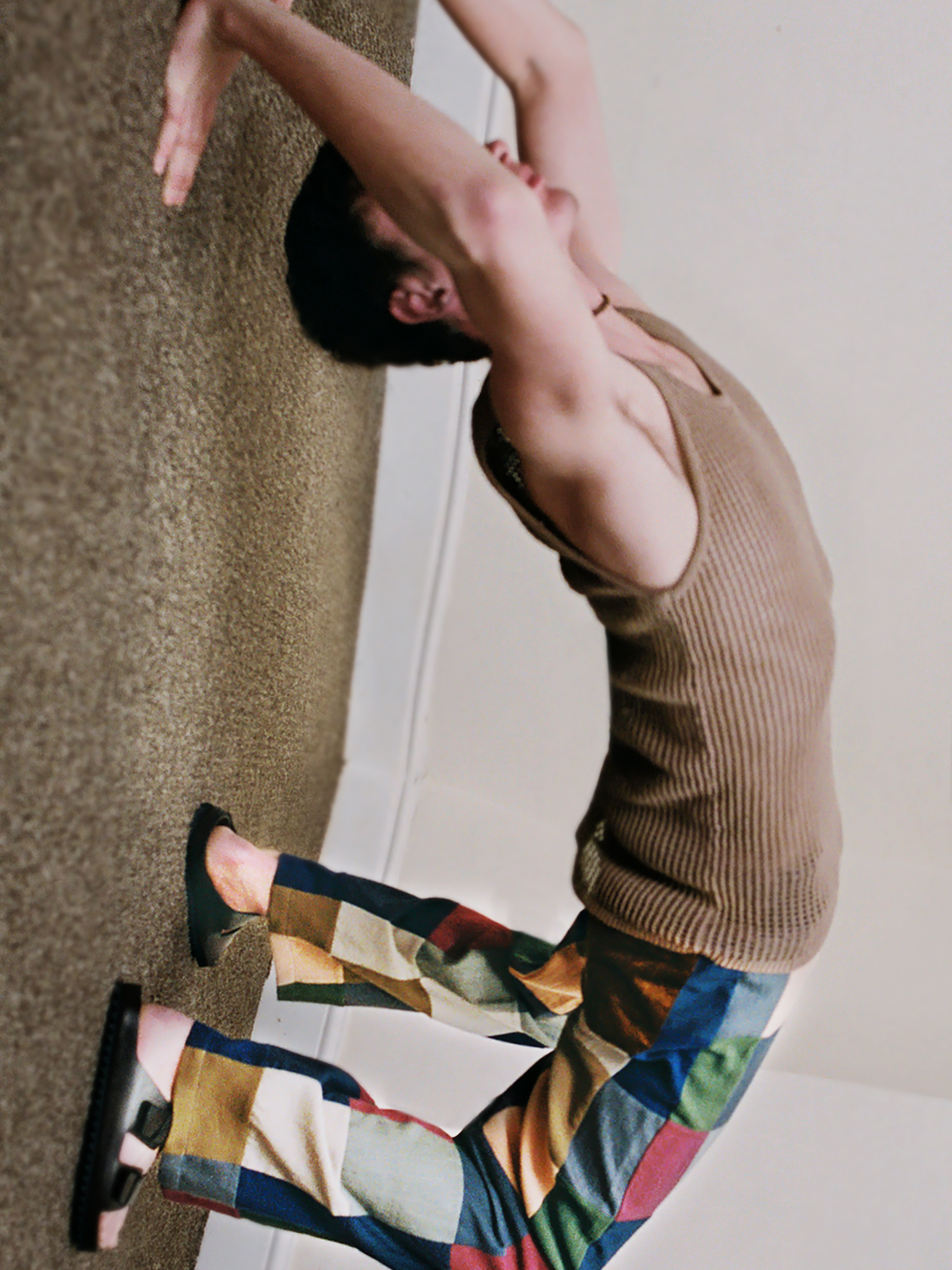 Top by NANUSHKA, trousers by ACNE STUDIOS, sandals by OFFICINE CREATIVE, necklace by COMPLETED WORKS