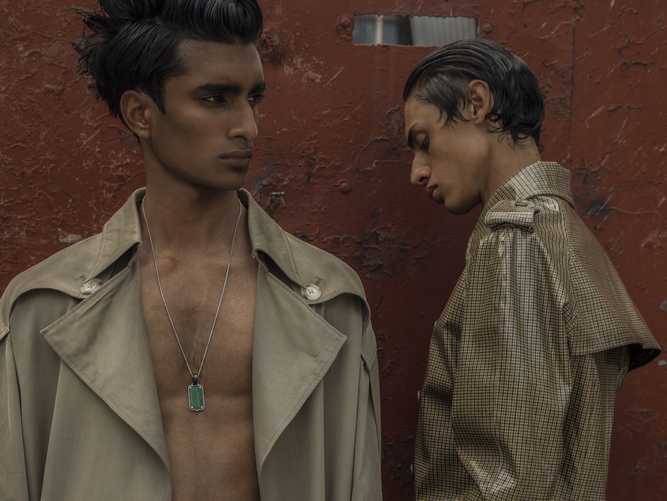Jeenu wears coat by CHIN MENSWEAR INTL, necklace by STEPHEN WEBSTER, Benjamin wears coat by MOSCHINO