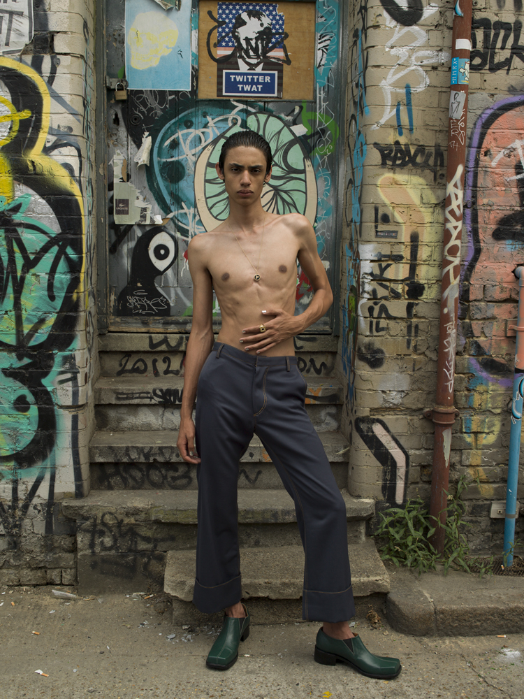 Trousers by CHIN MENSWEAR INTL, necklace and ring by STEPHEN WEBSTER, shoes by ROCKER
