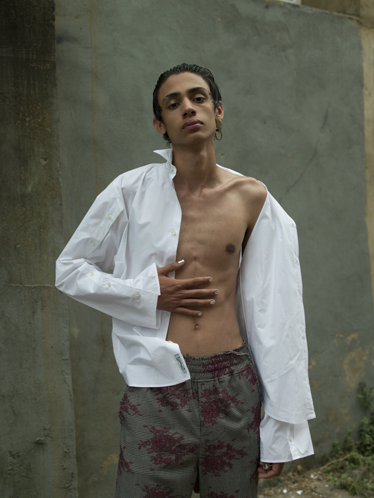 Shirt by MCQ, trousers by 3.PARADIS, earring by SLIM BARRETT