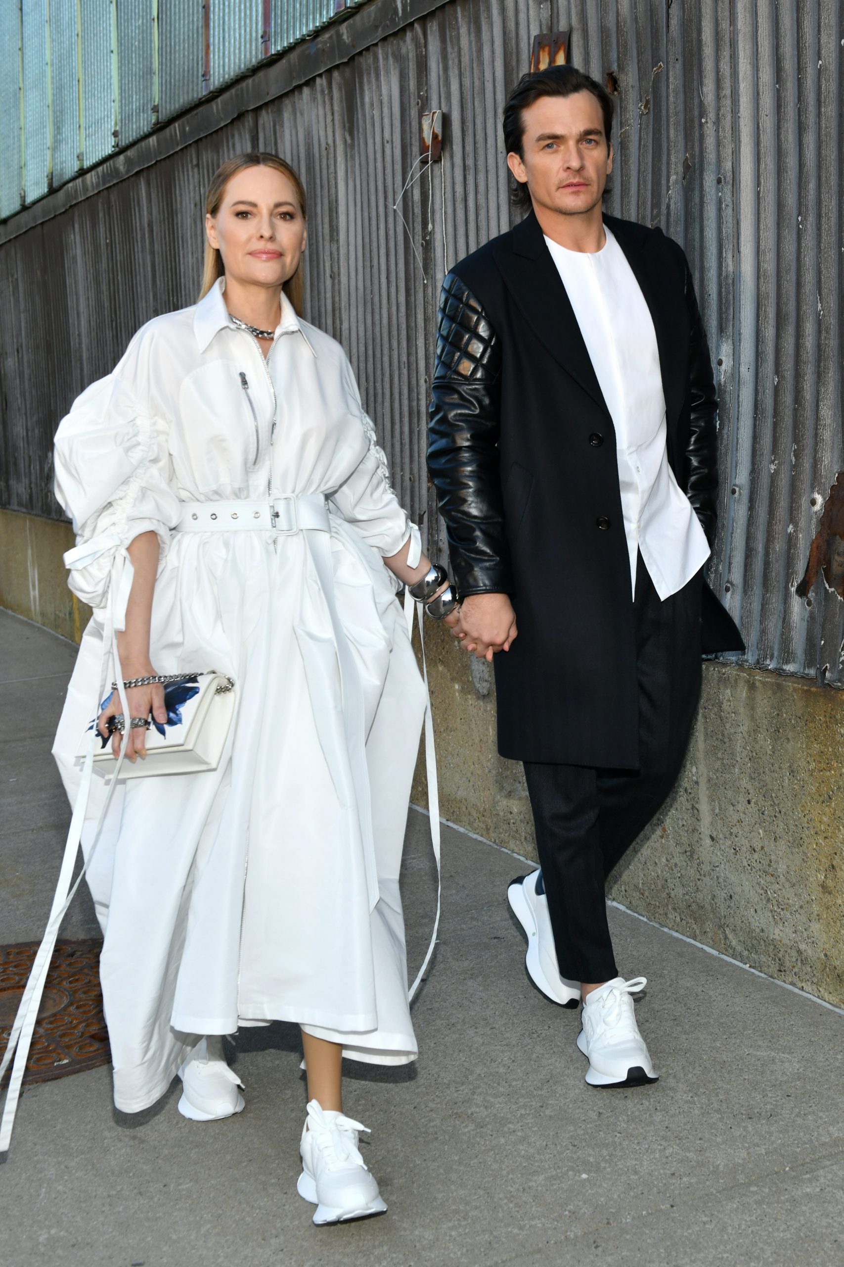 Aimee Mullins and Rupert Friend attend the Alexander McQueen AW22 Runway Show at Brooklyn Navy Yard on March 15, 2022 in Brooklyn City. (Photo by Craig Barritt/Getty Images for Alexander McQueen)