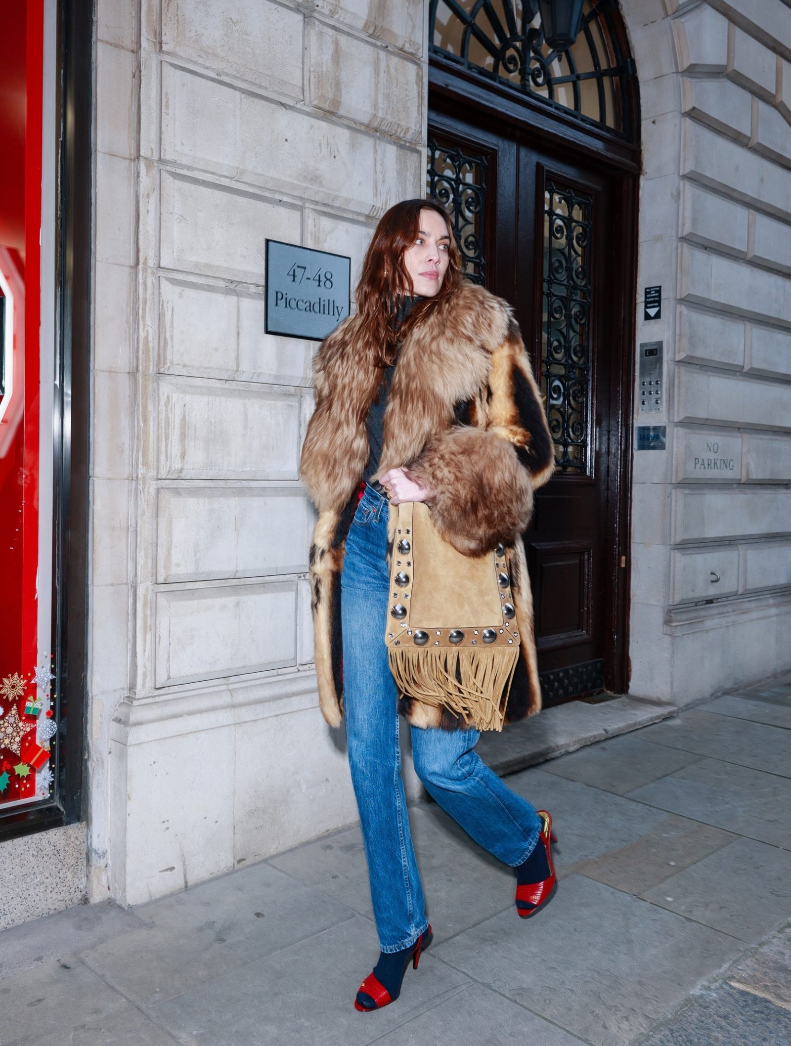 The style icon pairs statement Ladycrush sandals with a Nellcôte fringed bag, both Valentino Garavani. (Photo: Valentino / Getty Images)