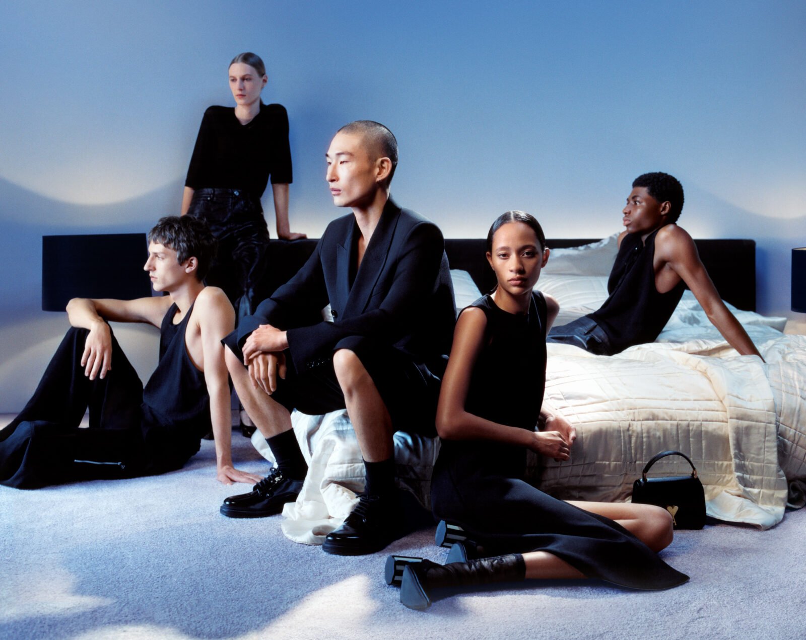 The AMI SS24 campaign captures the monochrome quiet intensity of friendship, set against the serenity of dawn.