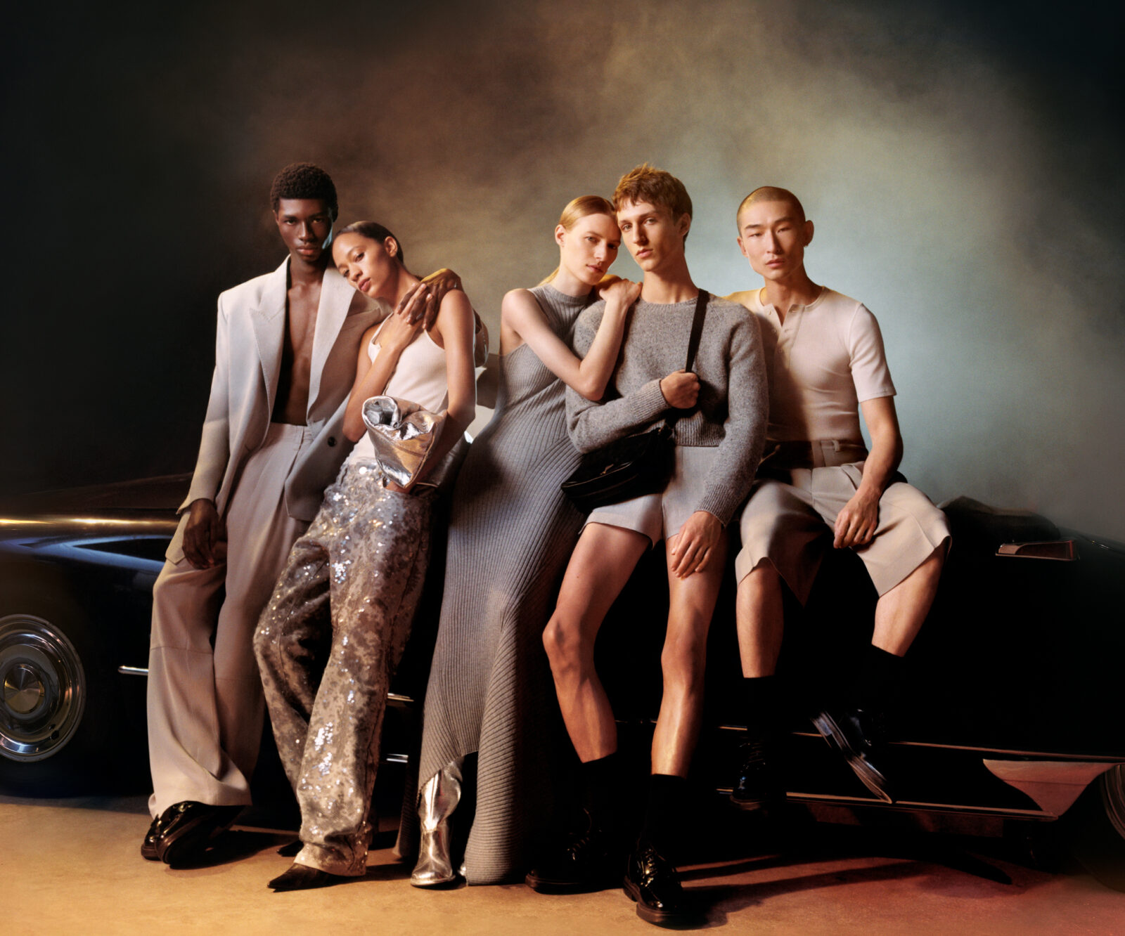 The AMI SS24 collection presents a clash of textures and tailoring, set against the seductive gleam of twilight.
