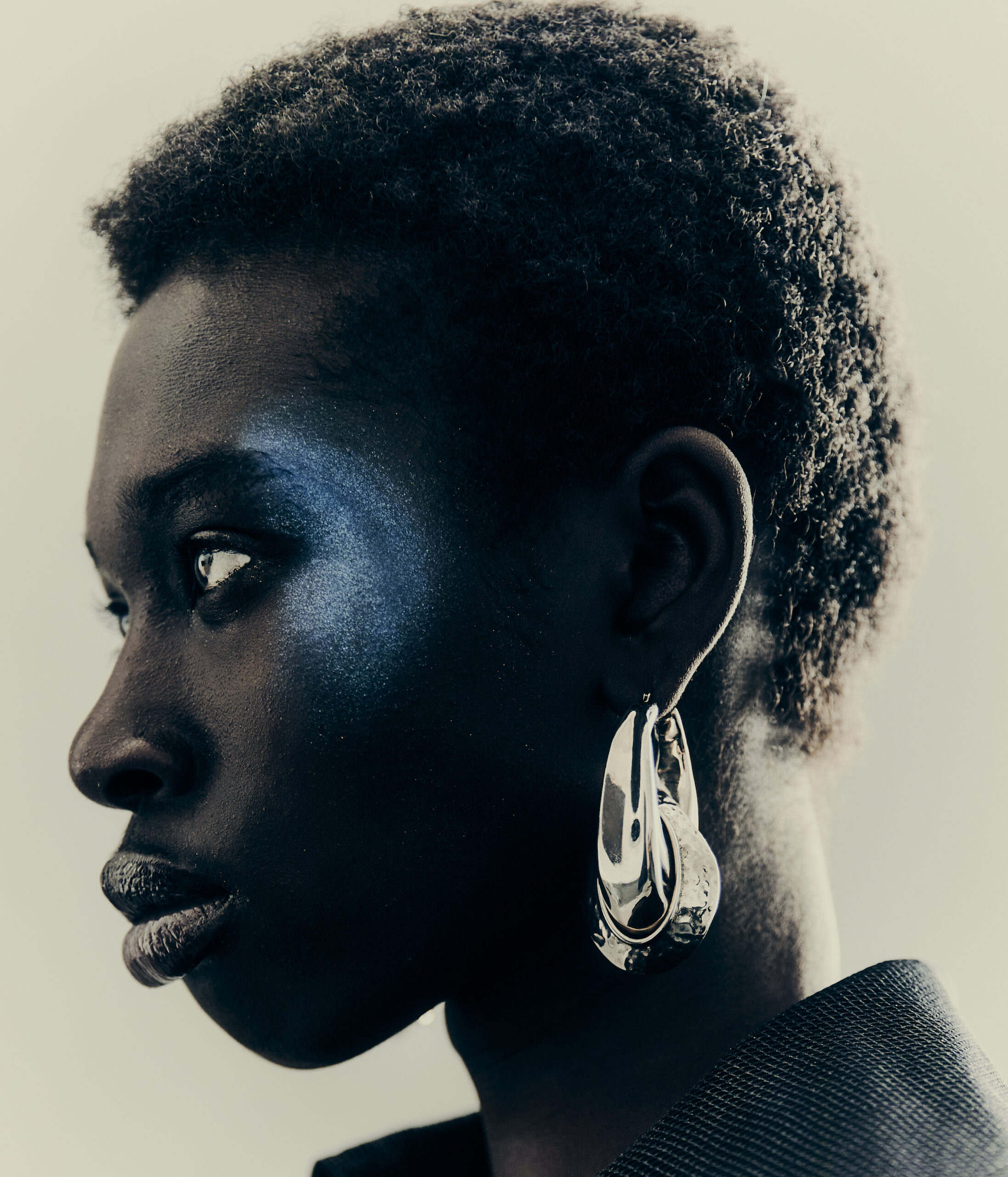 Awet wears earring by ALEXANDER MCQUEEN