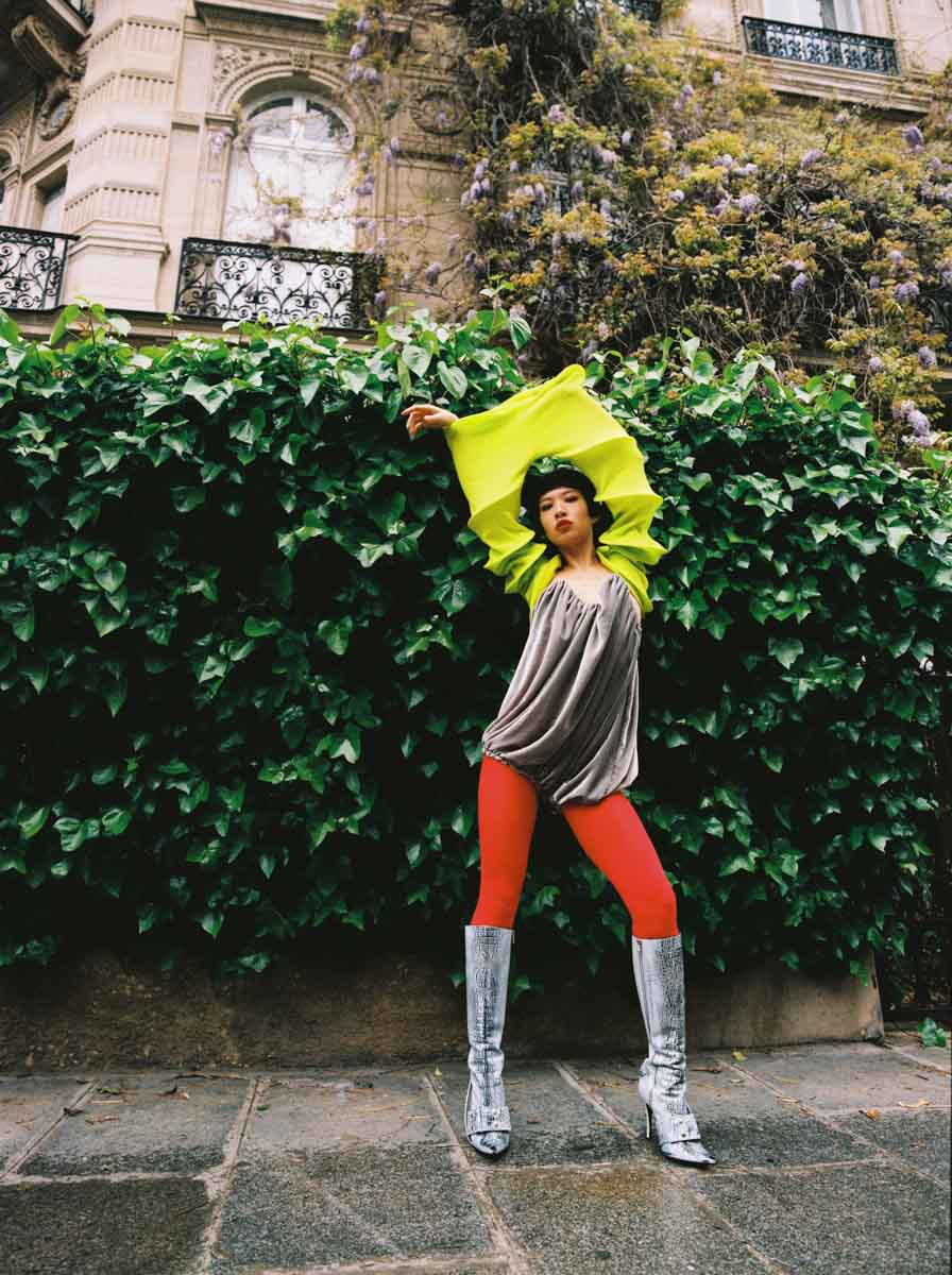 ANNIE wears playsuit by TRANSE, tights by FALKE, boots by DIESEL, pants by RUI