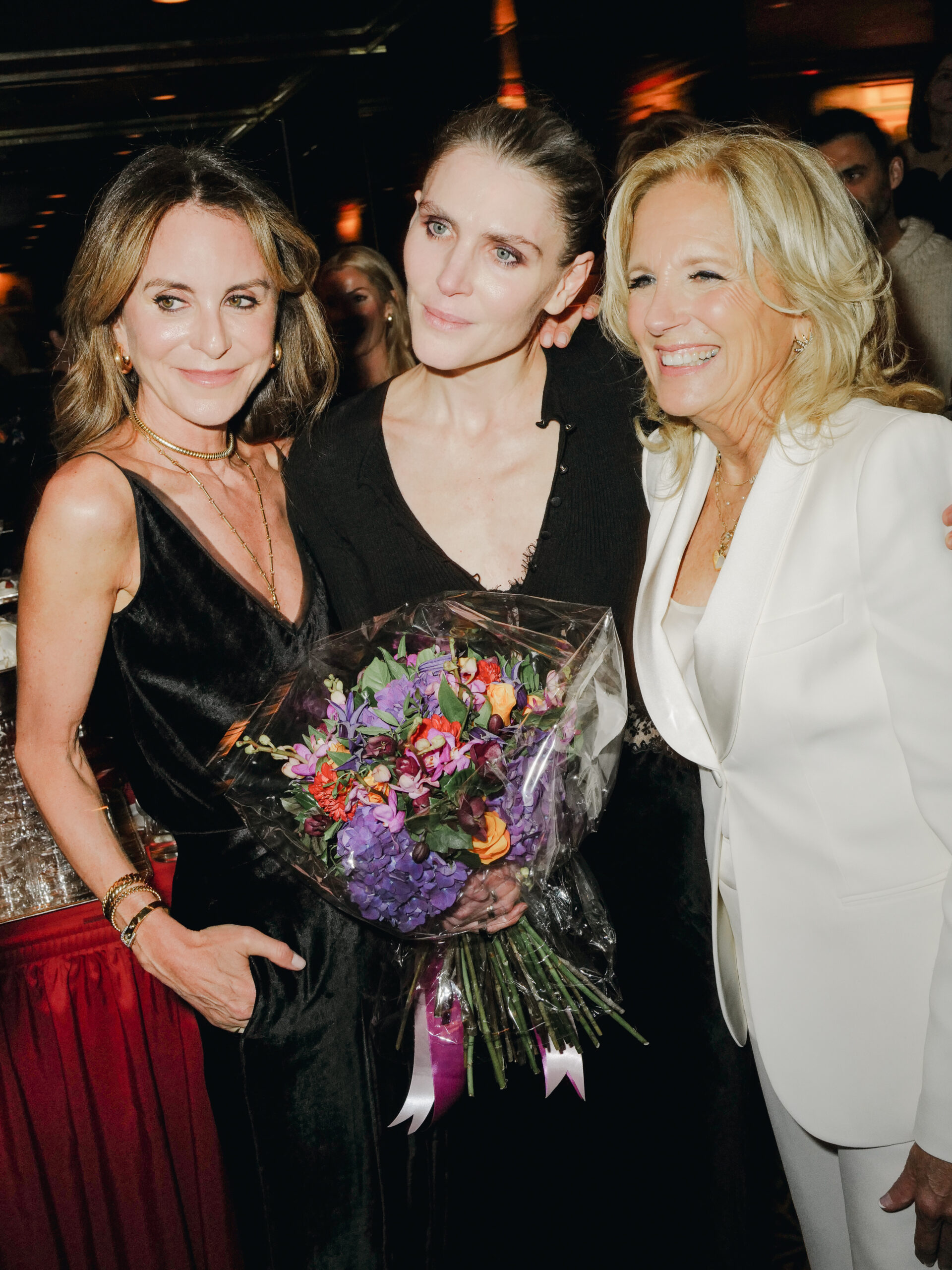 Elegance and camaraderie at The Doubles Club: Alison Loehnis and Gabriela Hearst share a moment with special guest First Lady Dr. Jill Biden during the Net-A-Porter capsule collection celebration. Images courtesy of BFA.