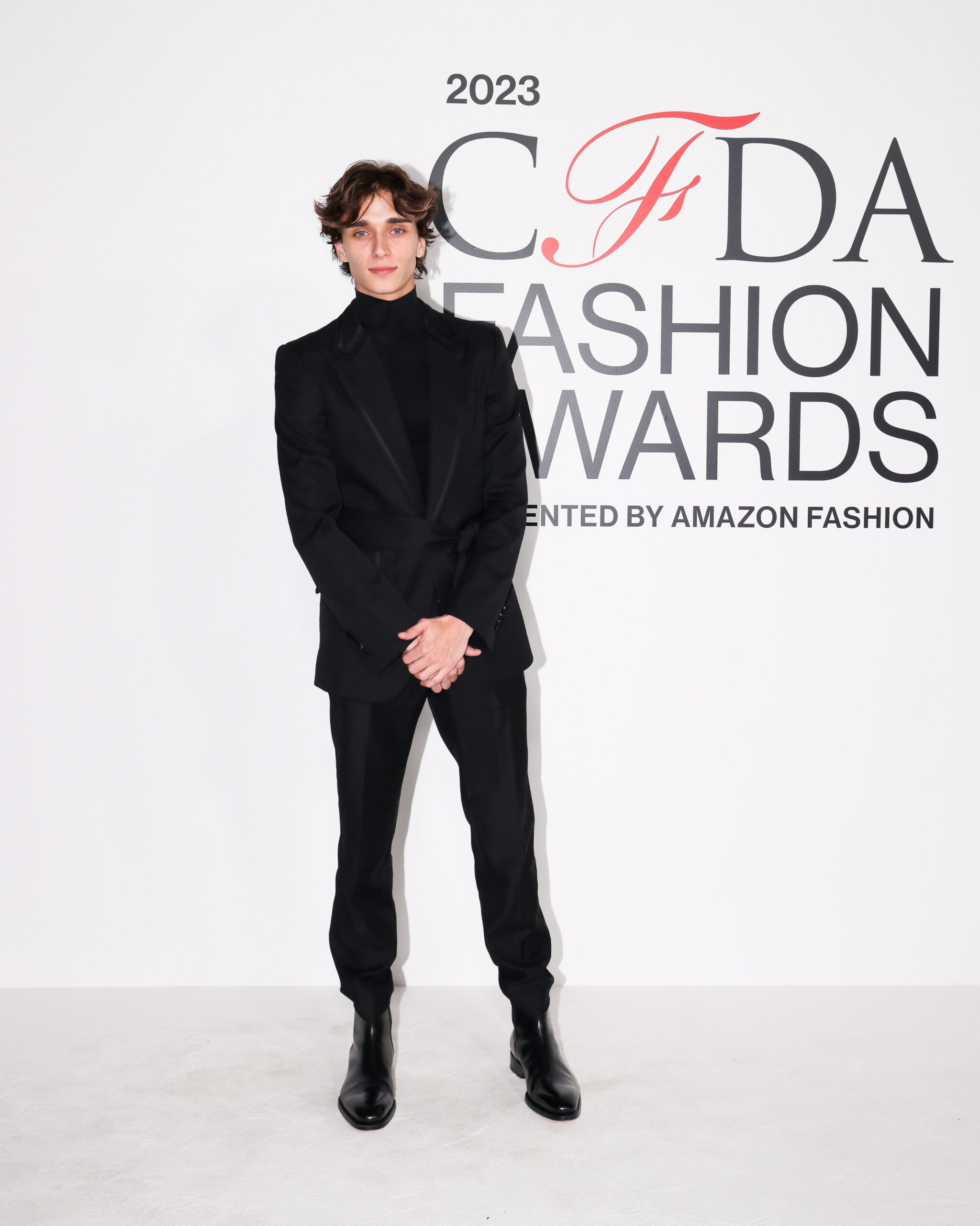 Josh Richards exudes effortless style at the 2023 CFDA Awards in a sleek black Dolce & Gabbana suit with satin detailing, paired with heeled Chelsea boots. Josh Richards exudes effortless style at the 2023 CFDA Awards in a sleek black Dolce & Gabbana suit with satin detailing, paired with heeled Chelsea boots.