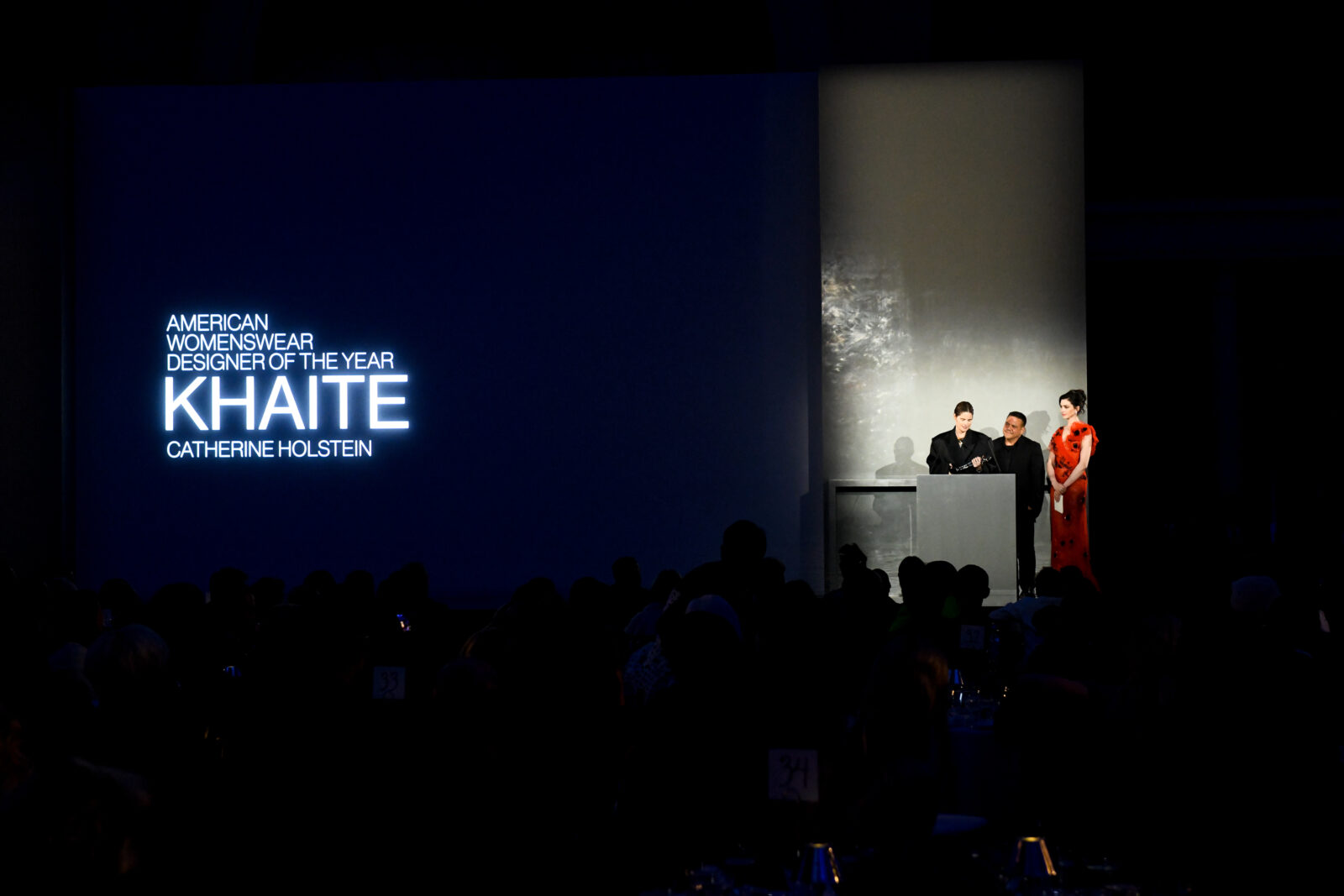 The spotlight shines on KHAITE as Catherine Holstein alongside Narciso Rodriguez and Anne Hathaway, is announced as the American Womenswear Designer of the Year at the CFDA Fashion Awards, a celebration of exceptional talent in the fashion industry. The spotlight shines on KHAITE as Catherine Holstein alongside Narciso Rodriguez and Anne Hathaway, is announced as the American Womenswear Designer of the Year at the CFDA Fashion Awards, a celebration of exceptional talent in the fashion industry.