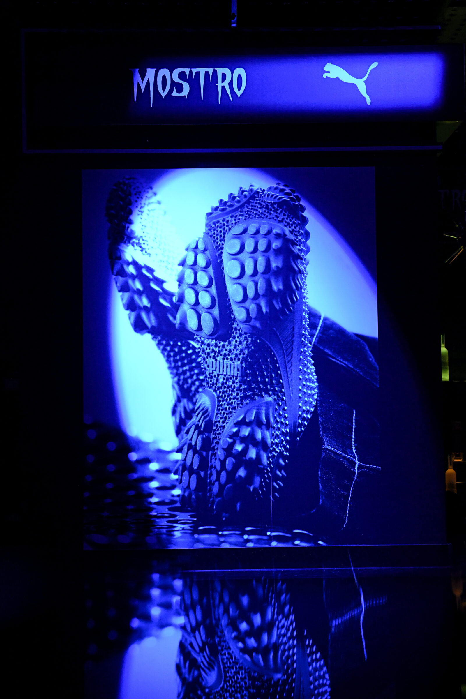 Illuminated in a striking blue hue, the iconic Puma Mostro sneaker takes center stage at the after-party, its signature spiked sole reflecting the event's cutting-edge vibe. (Images courtesy of BFA)